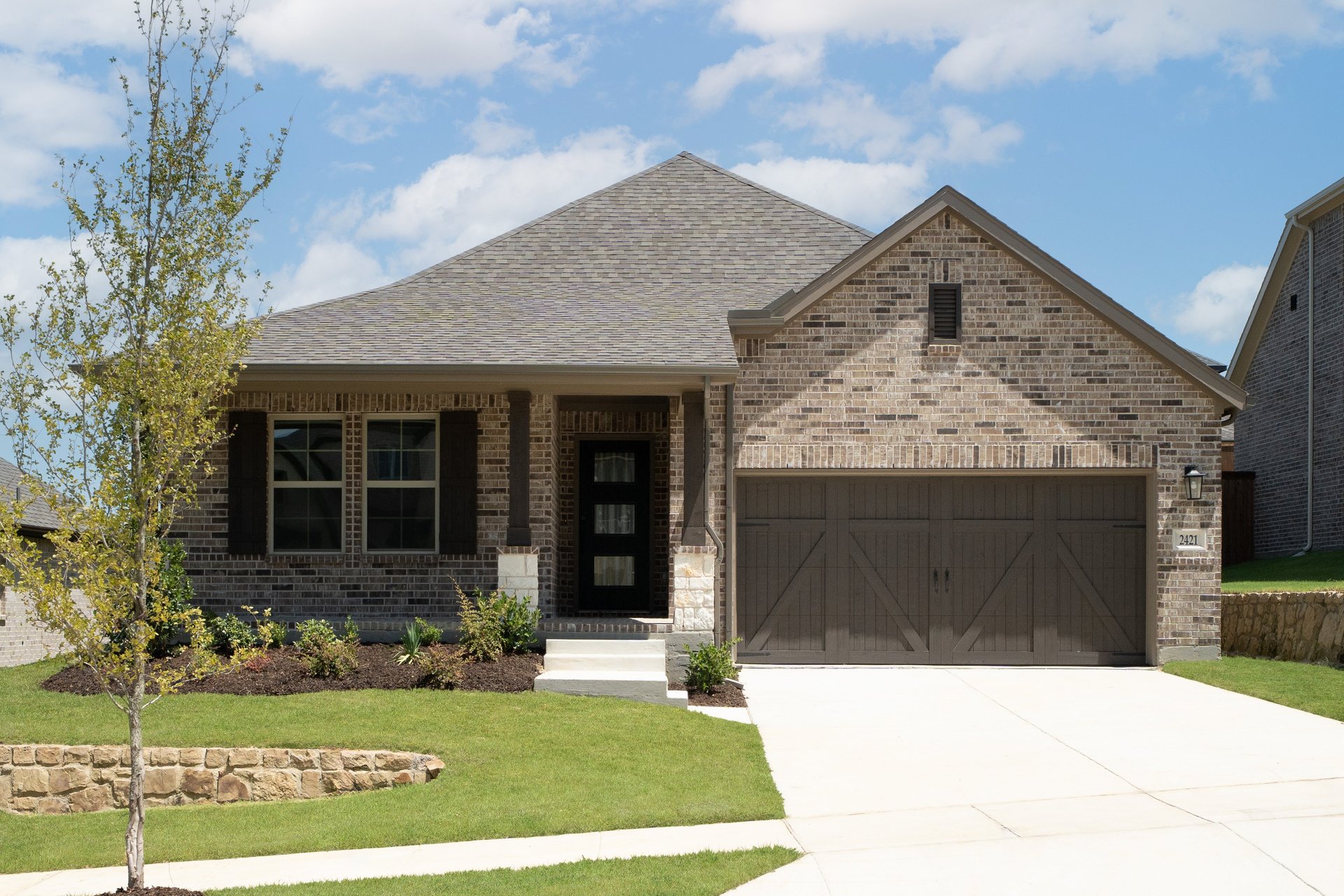 one-story with brick and stone exterior