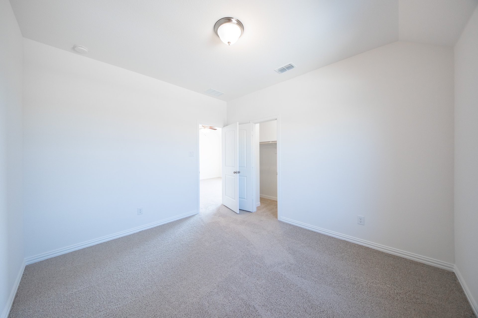 guest bedroom with carpet