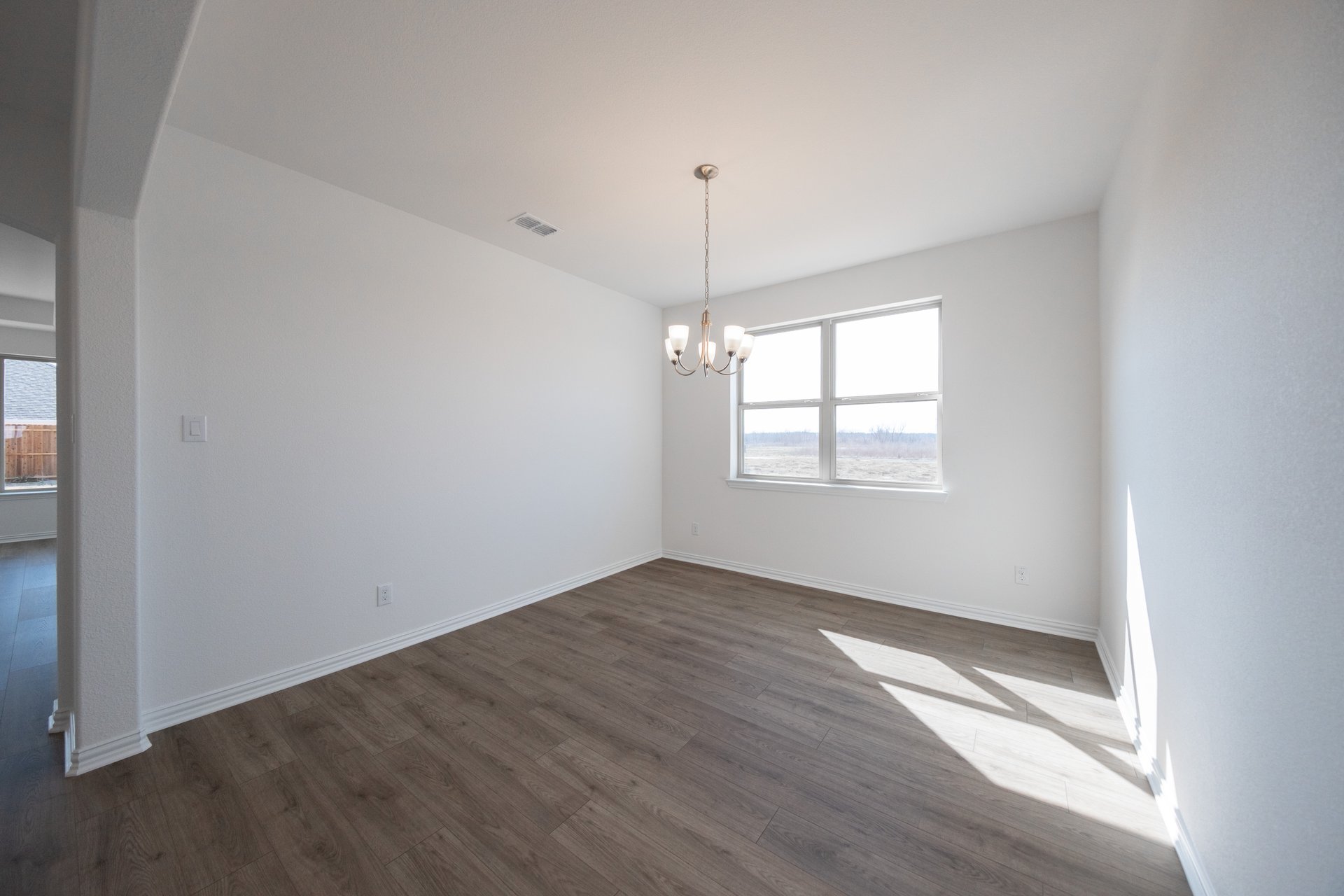spacious dining room with hardwood flooring