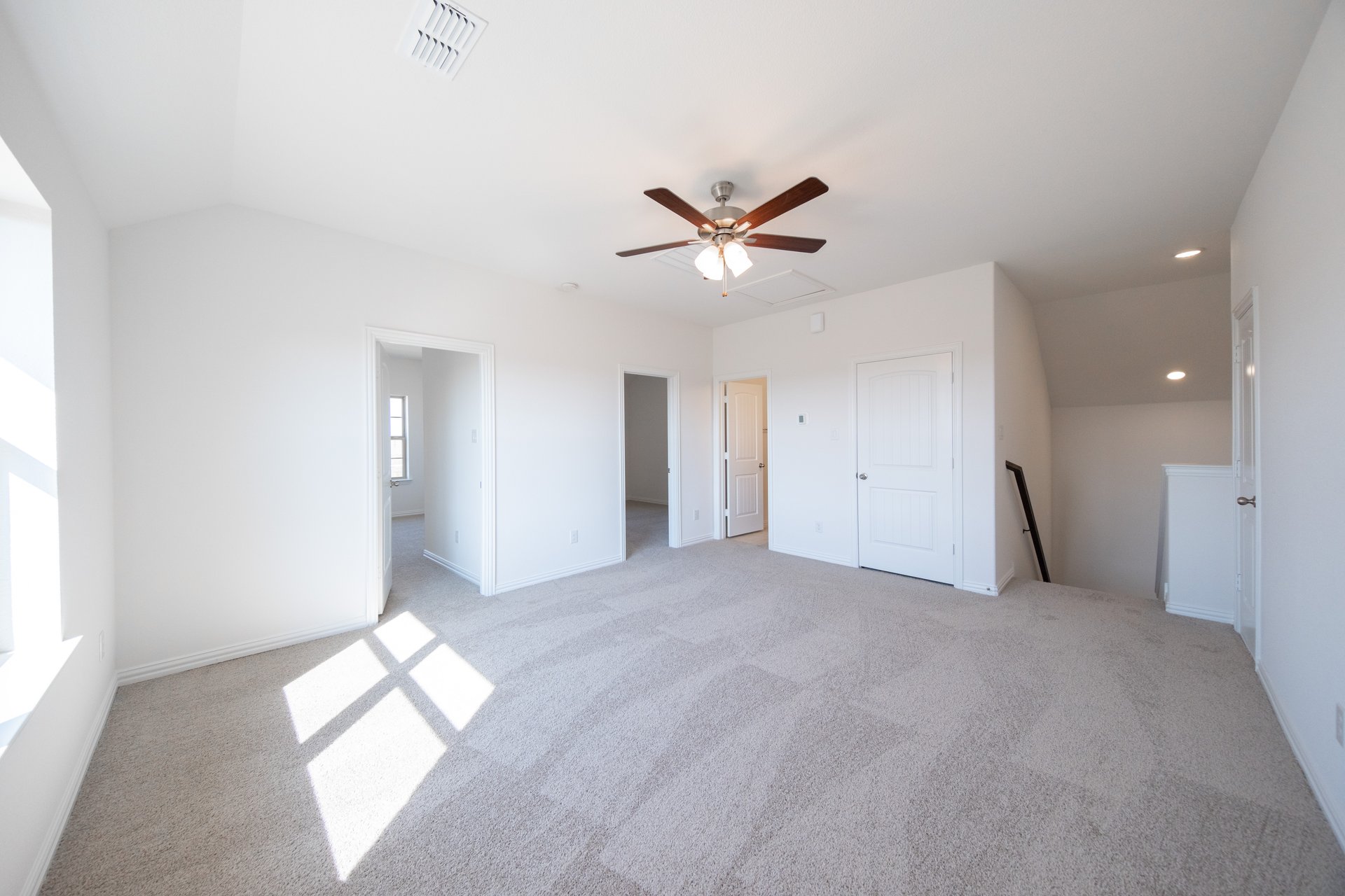 game room with carpet and ceiling fan