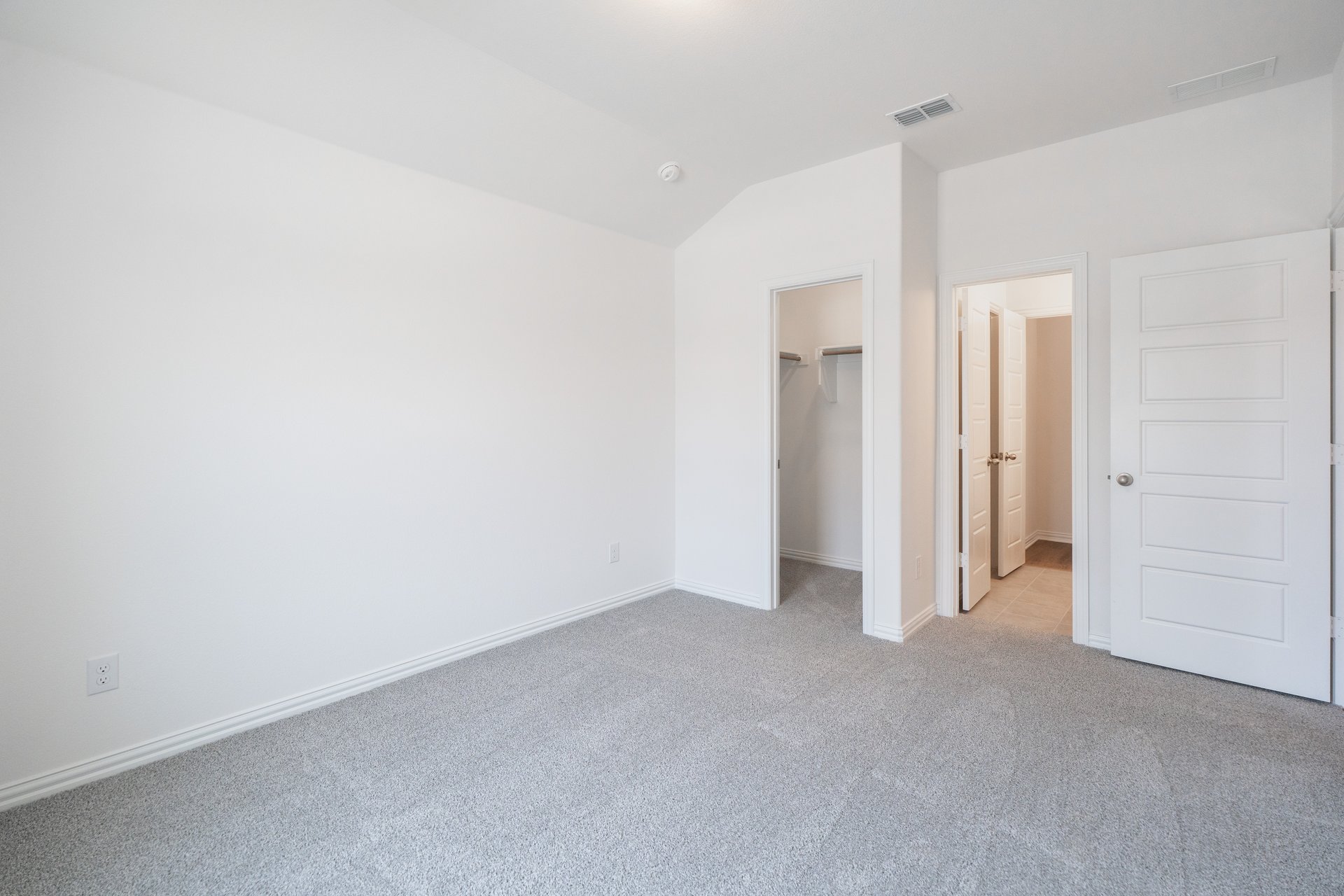 guest bedroom with carpet