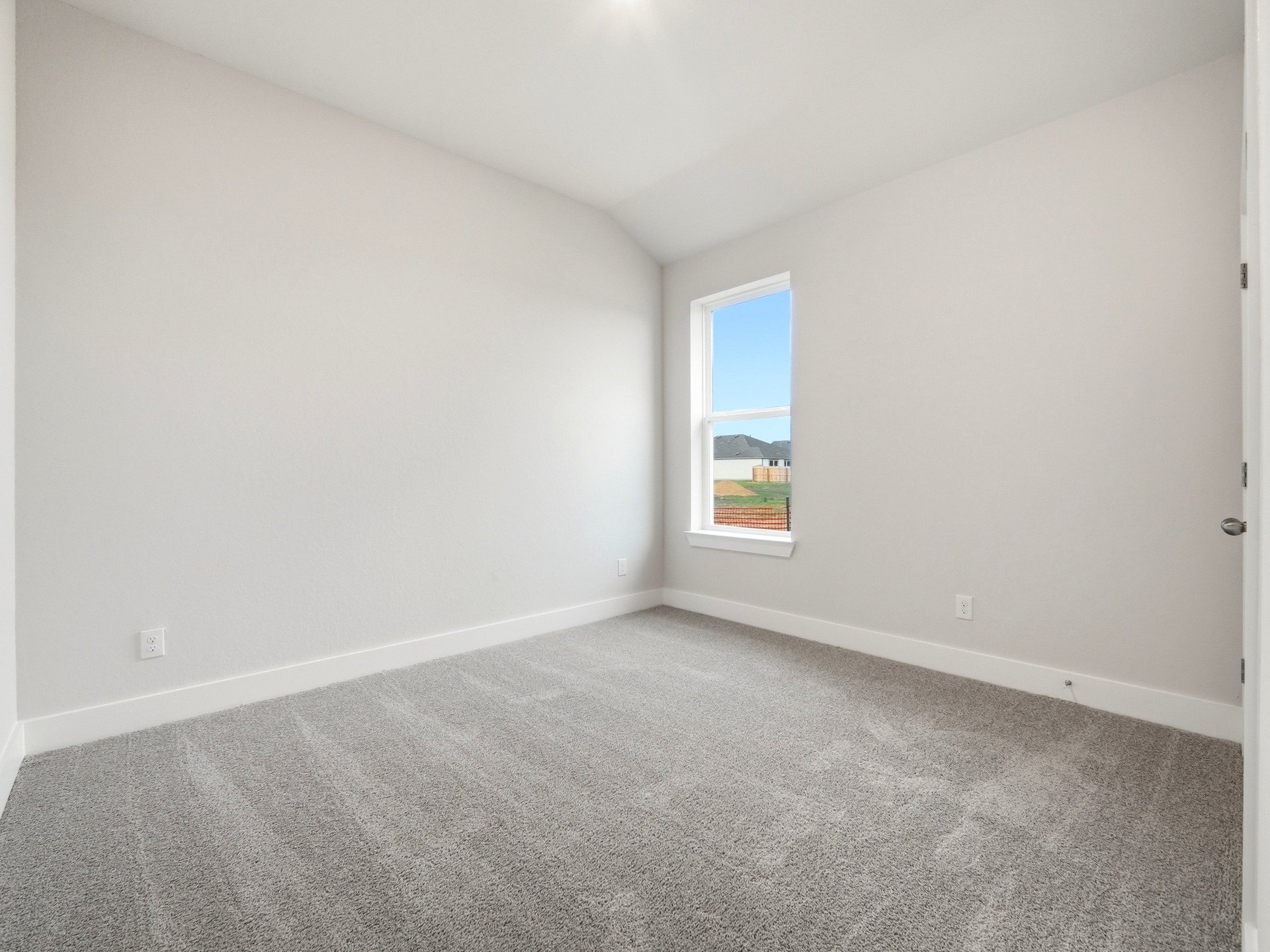 bedroom with carpet and windows