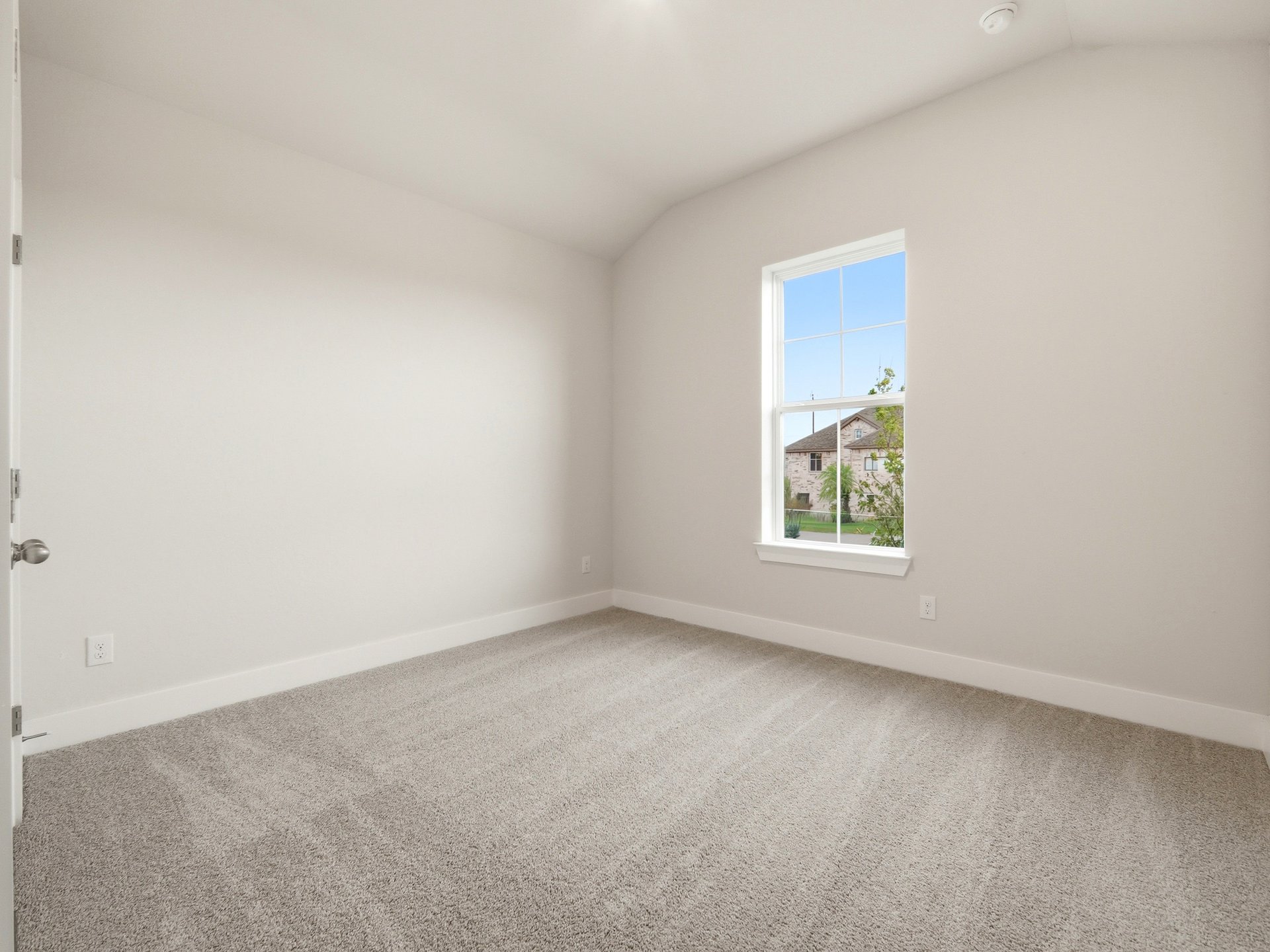 bedroom with carpet and windows