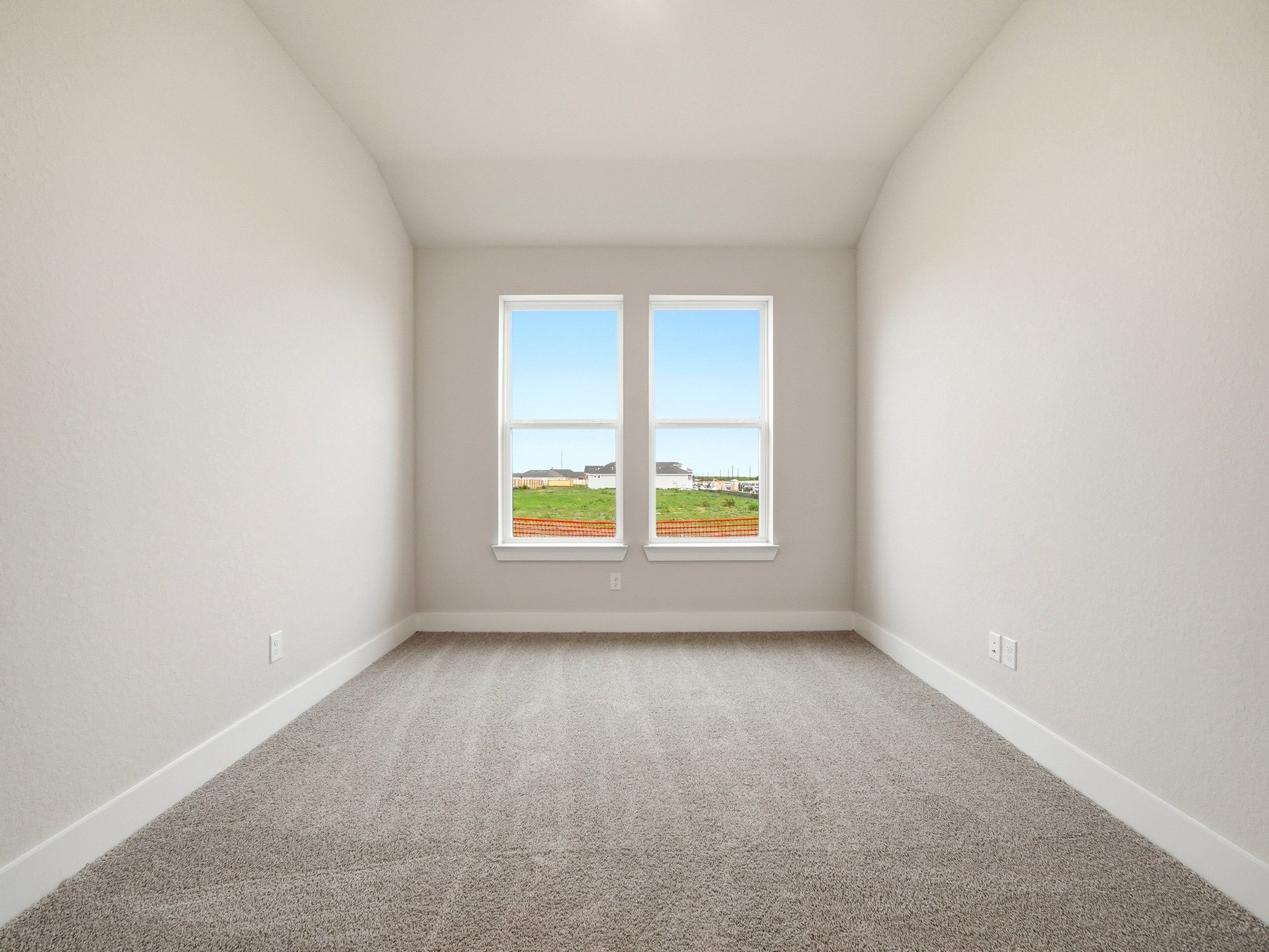 study with carpet flooring and windows 