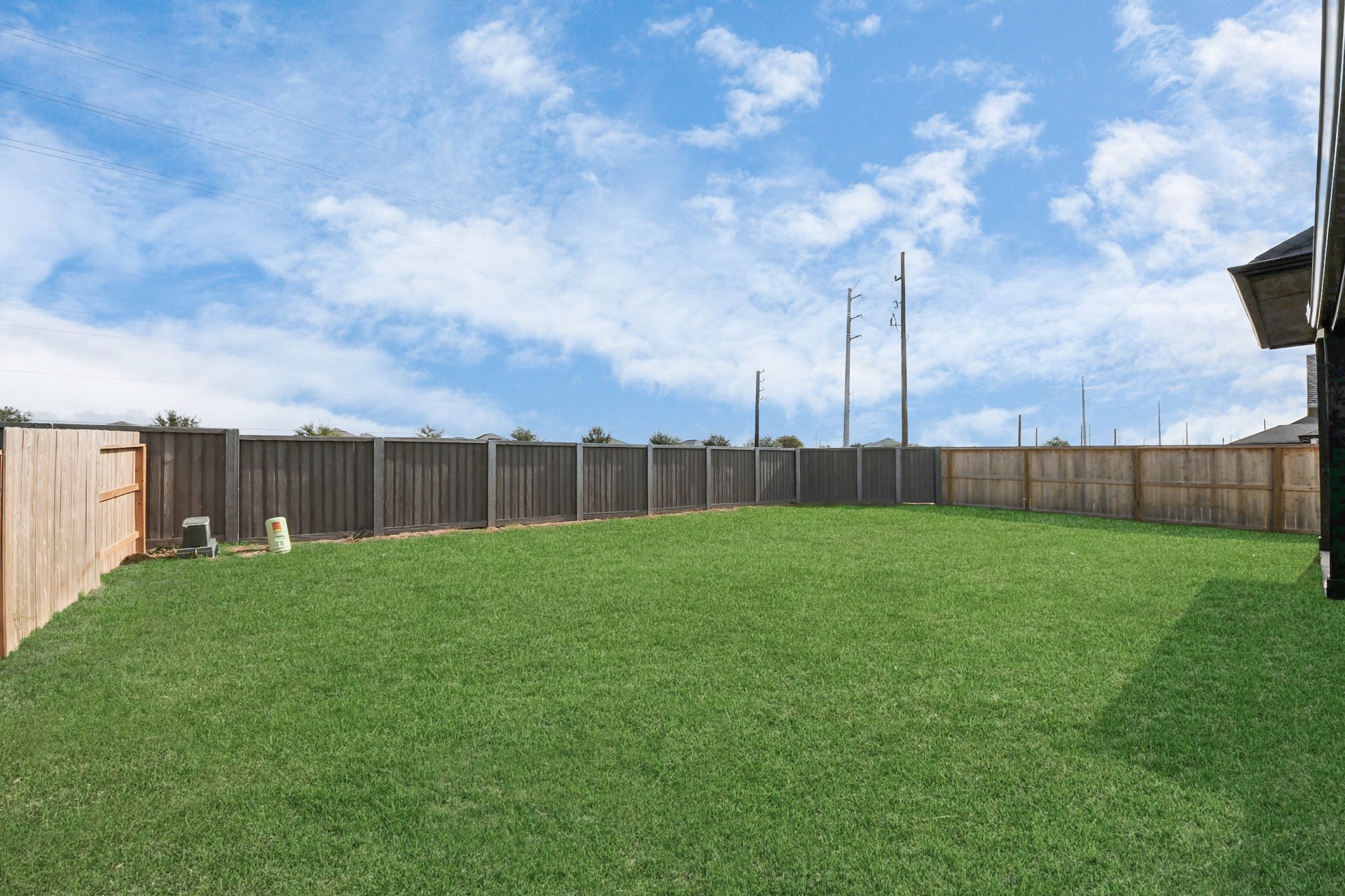 large fully sodded backyard with privacy fence