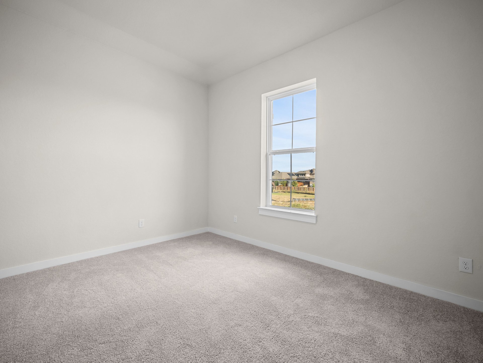 bedroom with carpet, a window & a sloped ceiling