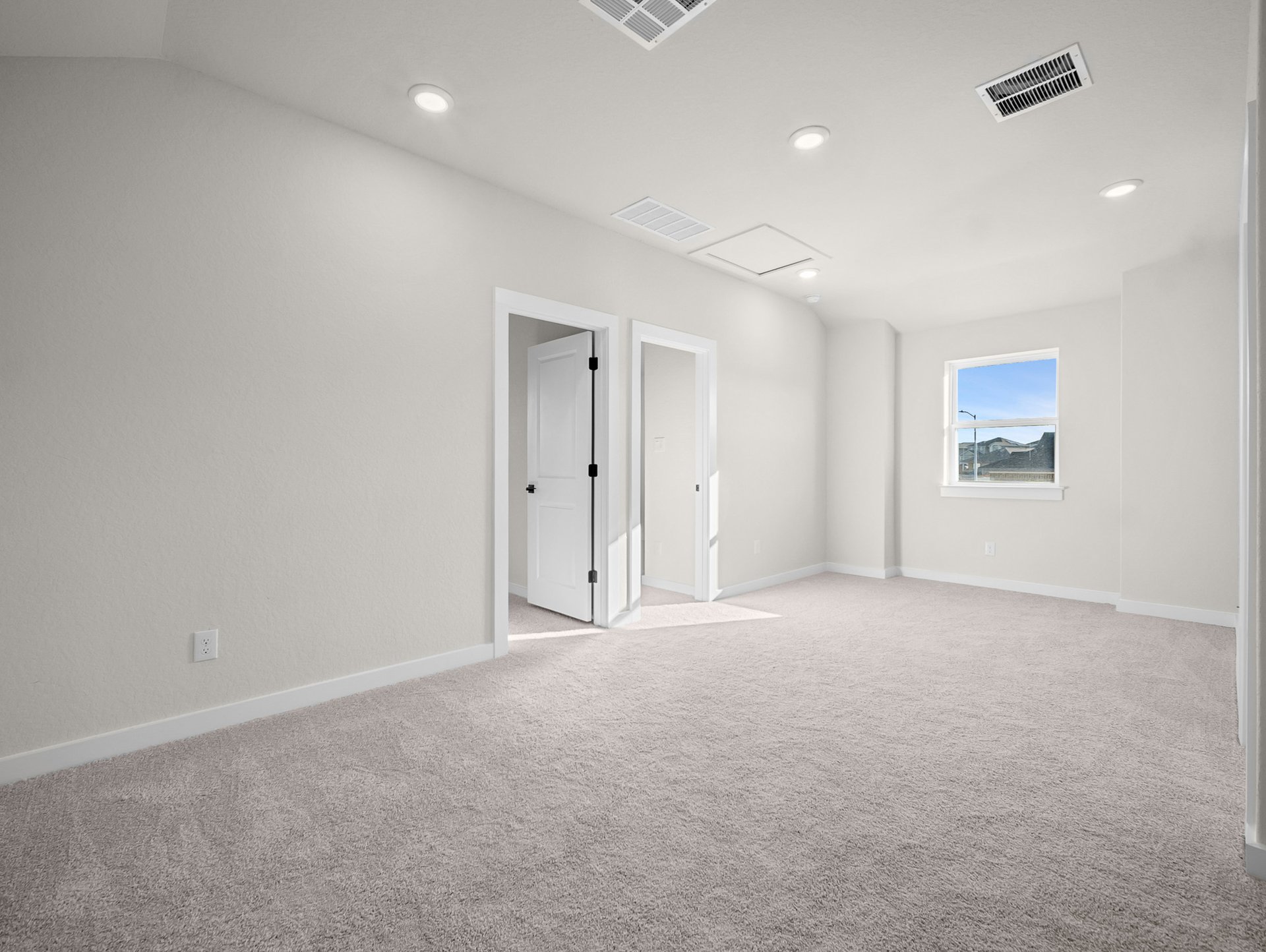 loft with carpet, window & a sloped ceiling