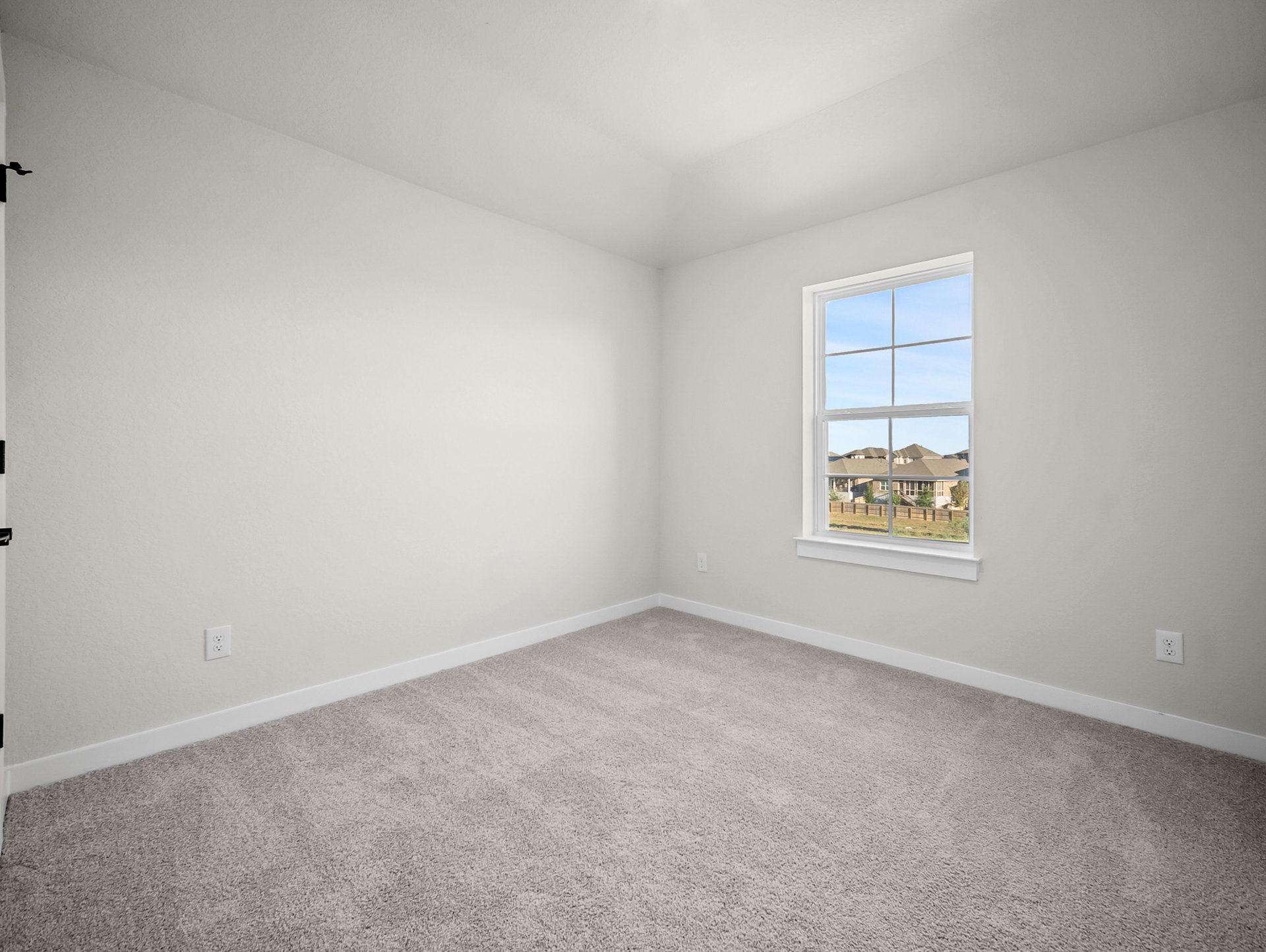 study with carpet, a window & a sloped ceiling