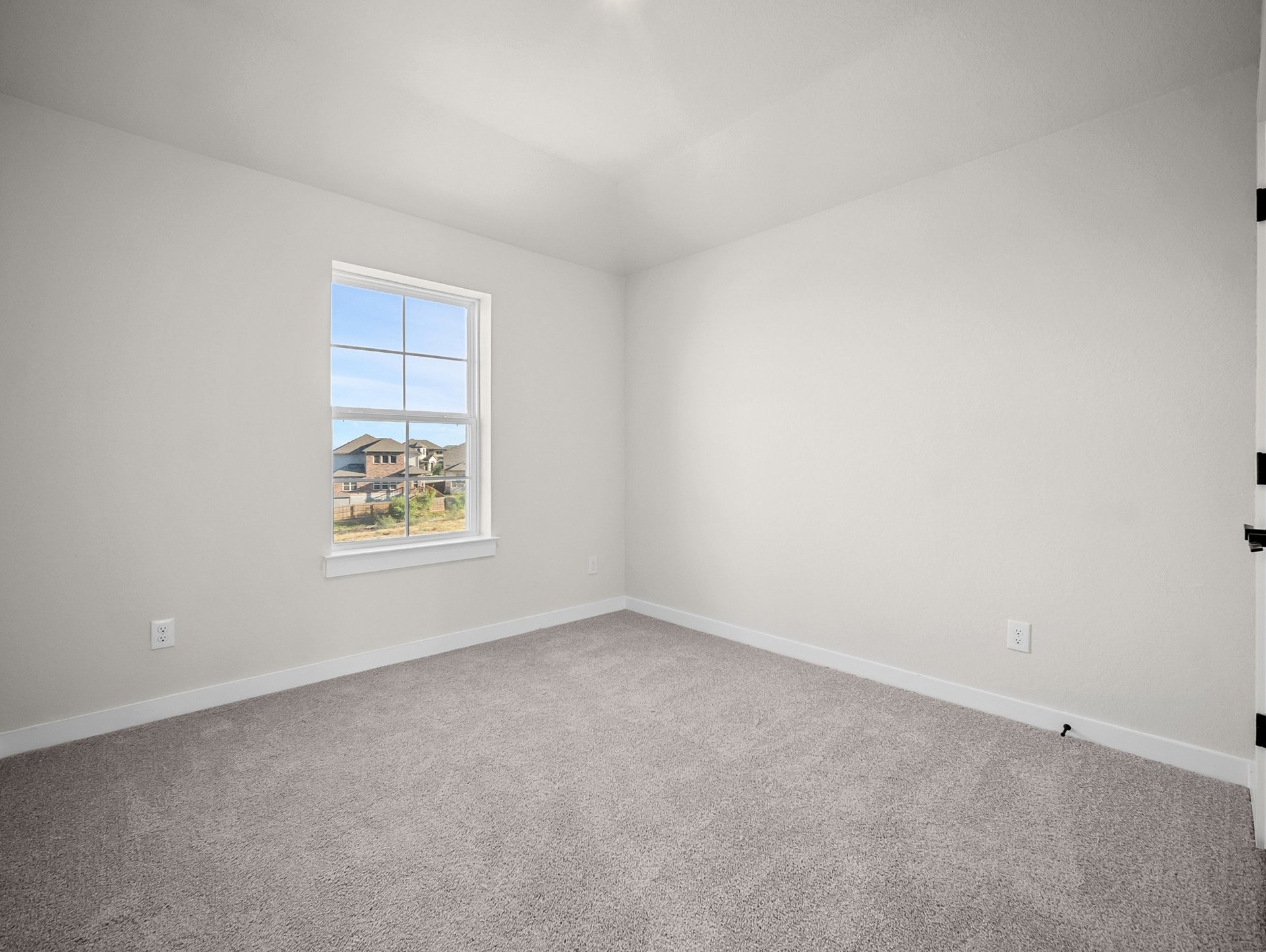 bedroom with carpet, a window & a sloped ceiling