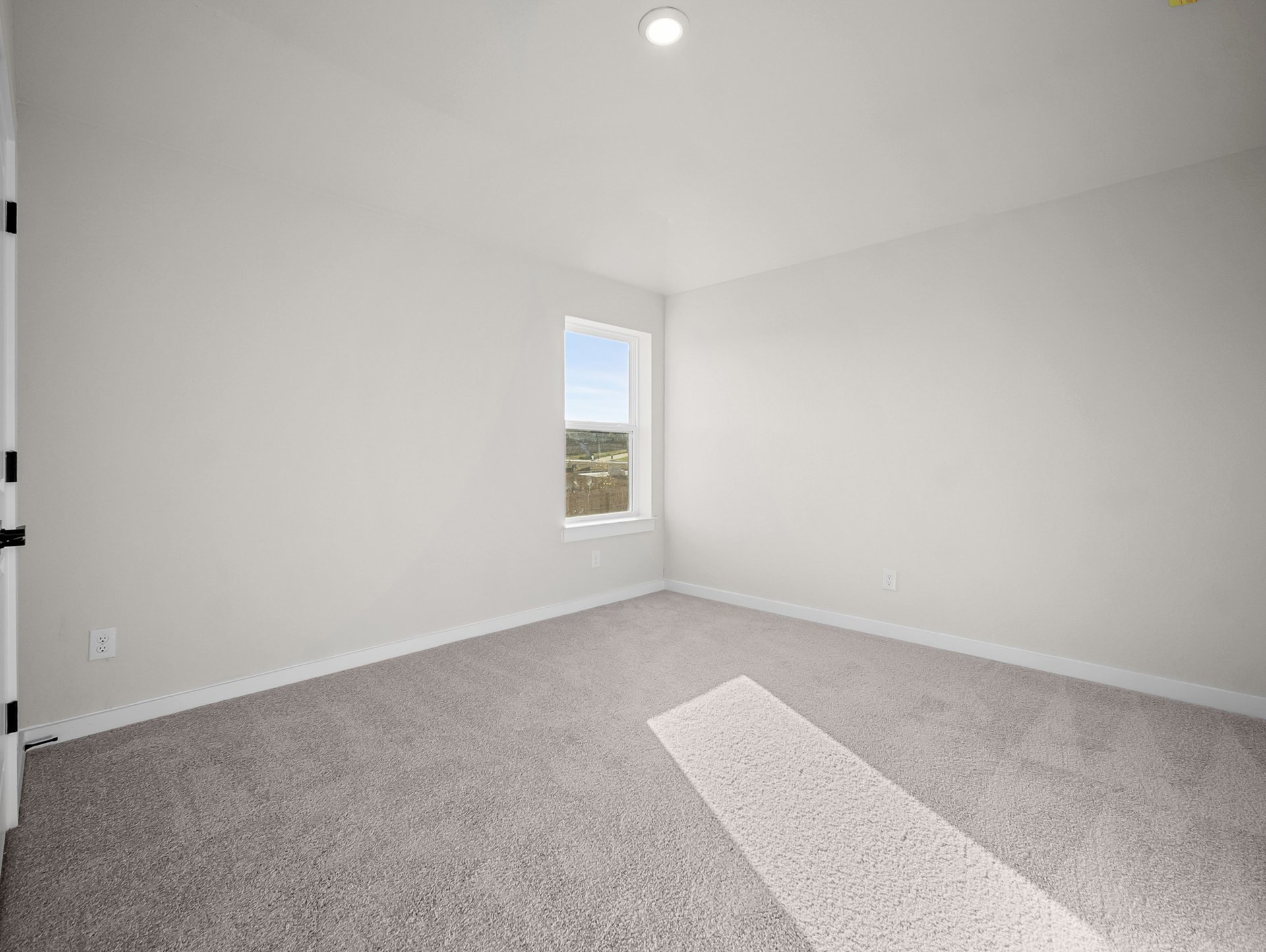 bedroom with carpet, a window & a sloped ceiling