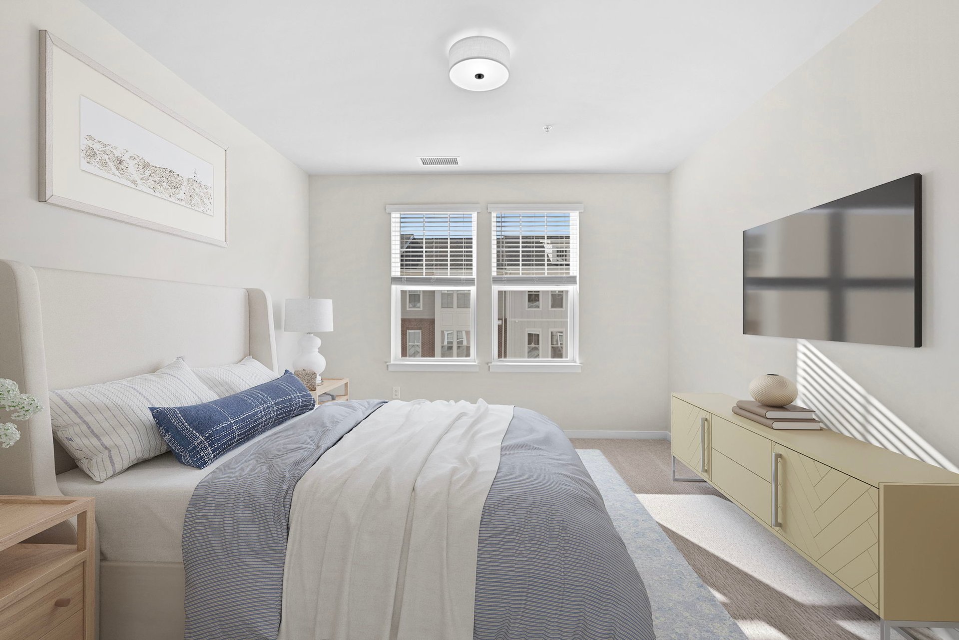 primary bedroom with nightstand, bed, and ottoman