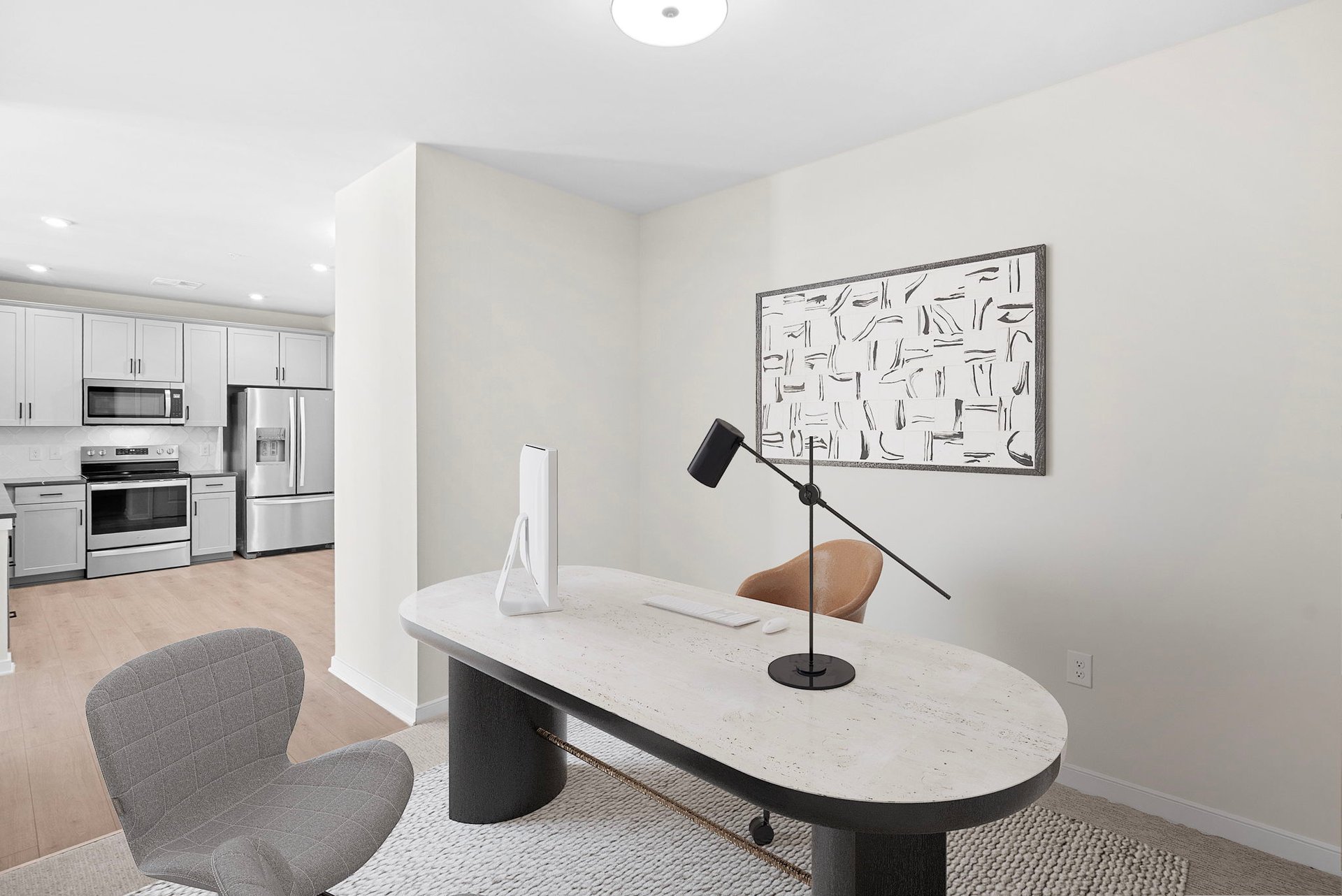 office with desk, artwork, and chairs