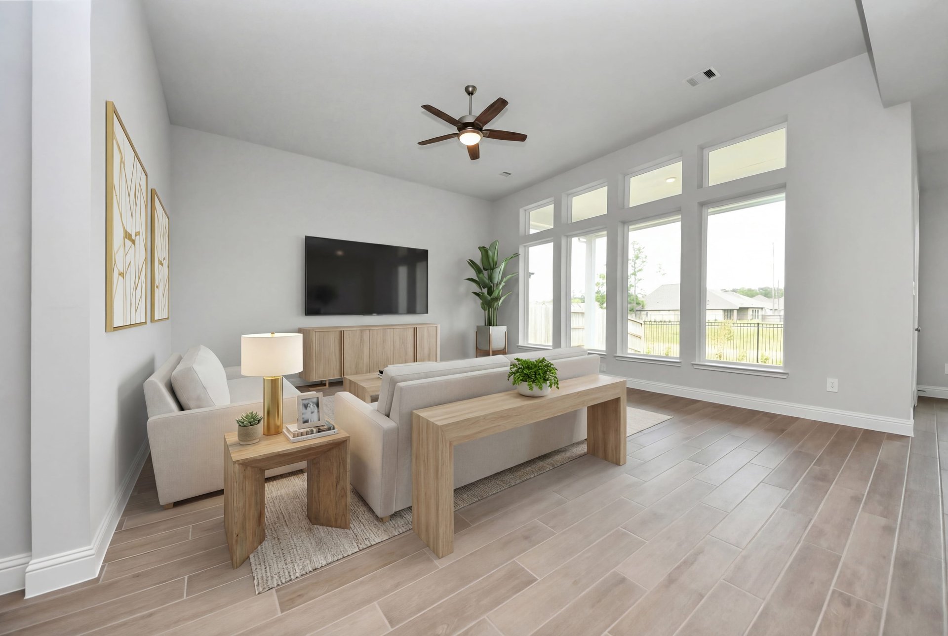 rendered great room photo with wood-look tile flooring and tall ceilings