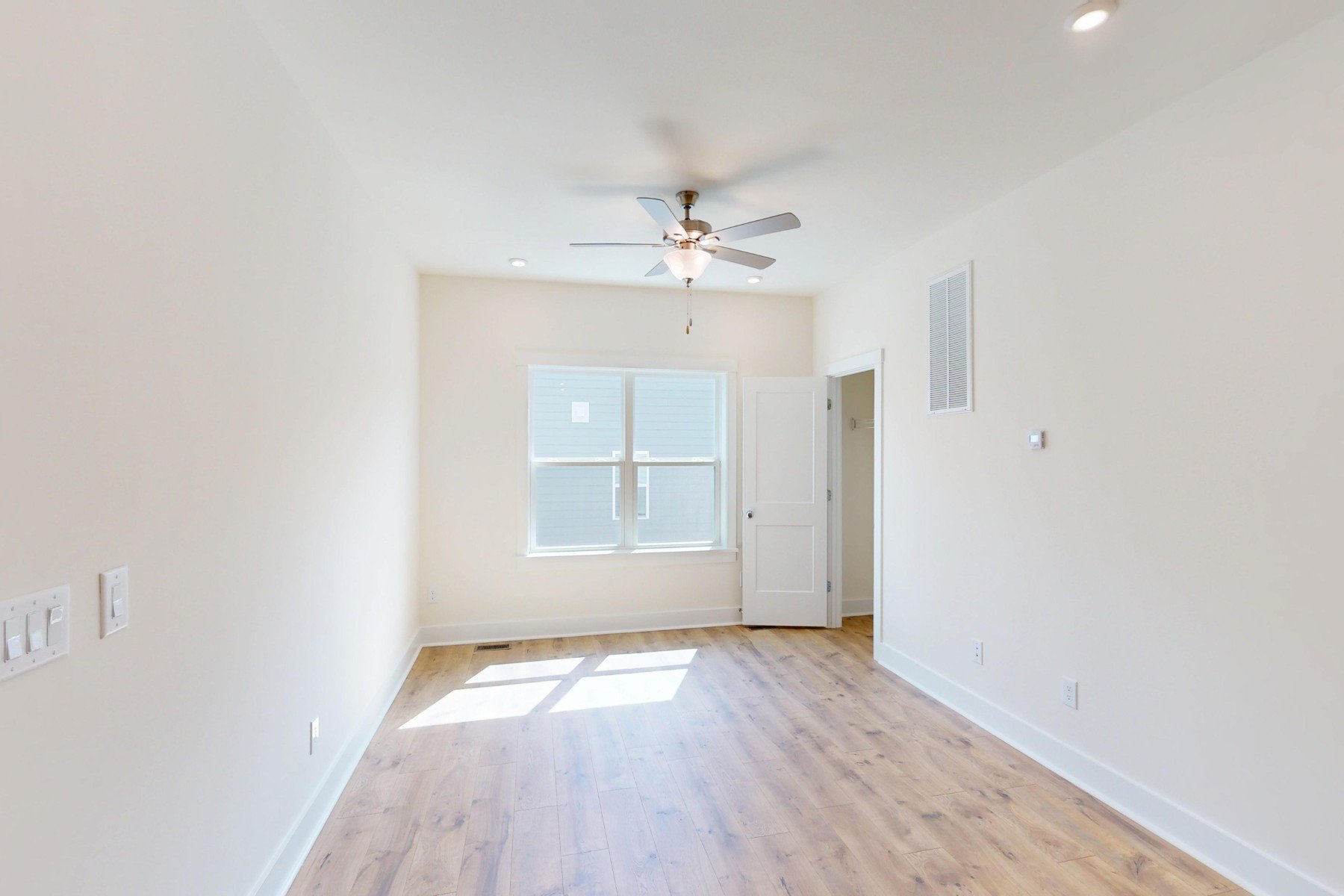 loft with two windows and a closet