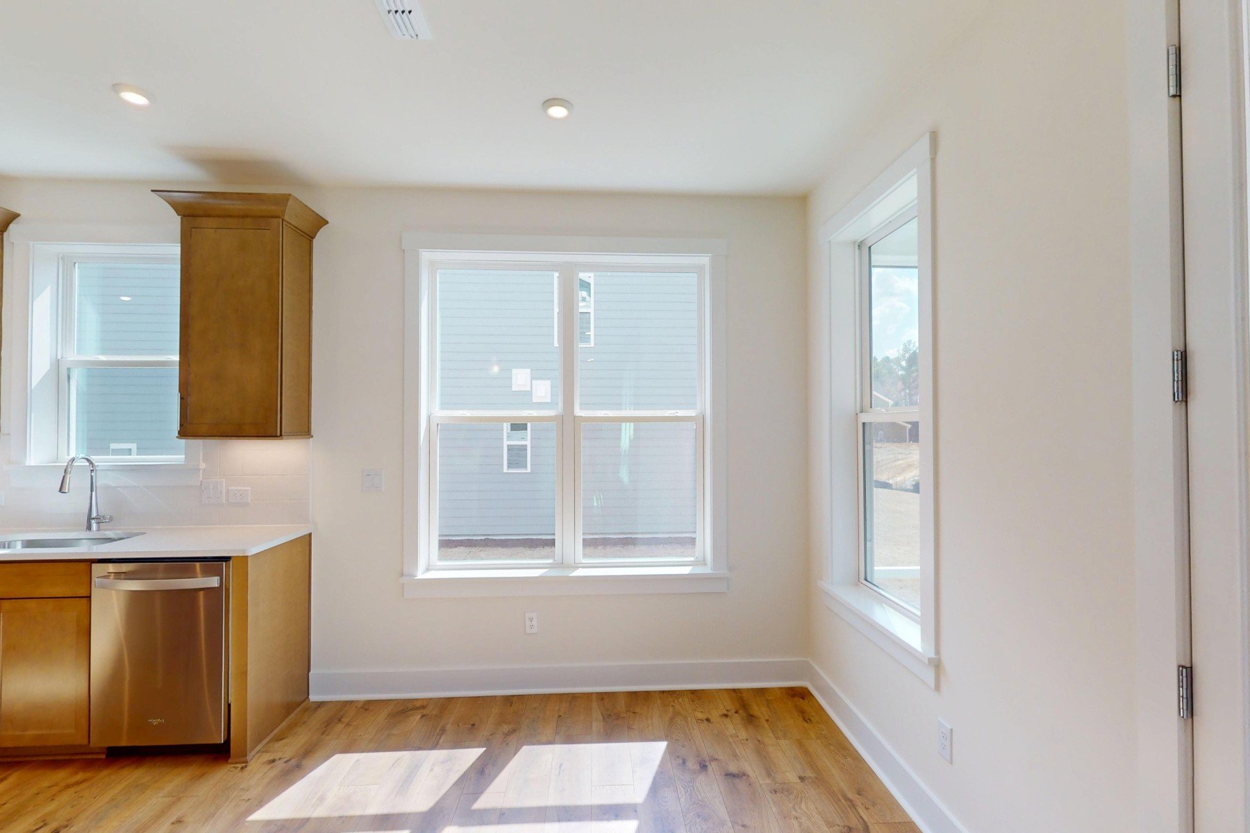 breakfast area with a few windows and access to the kitchen