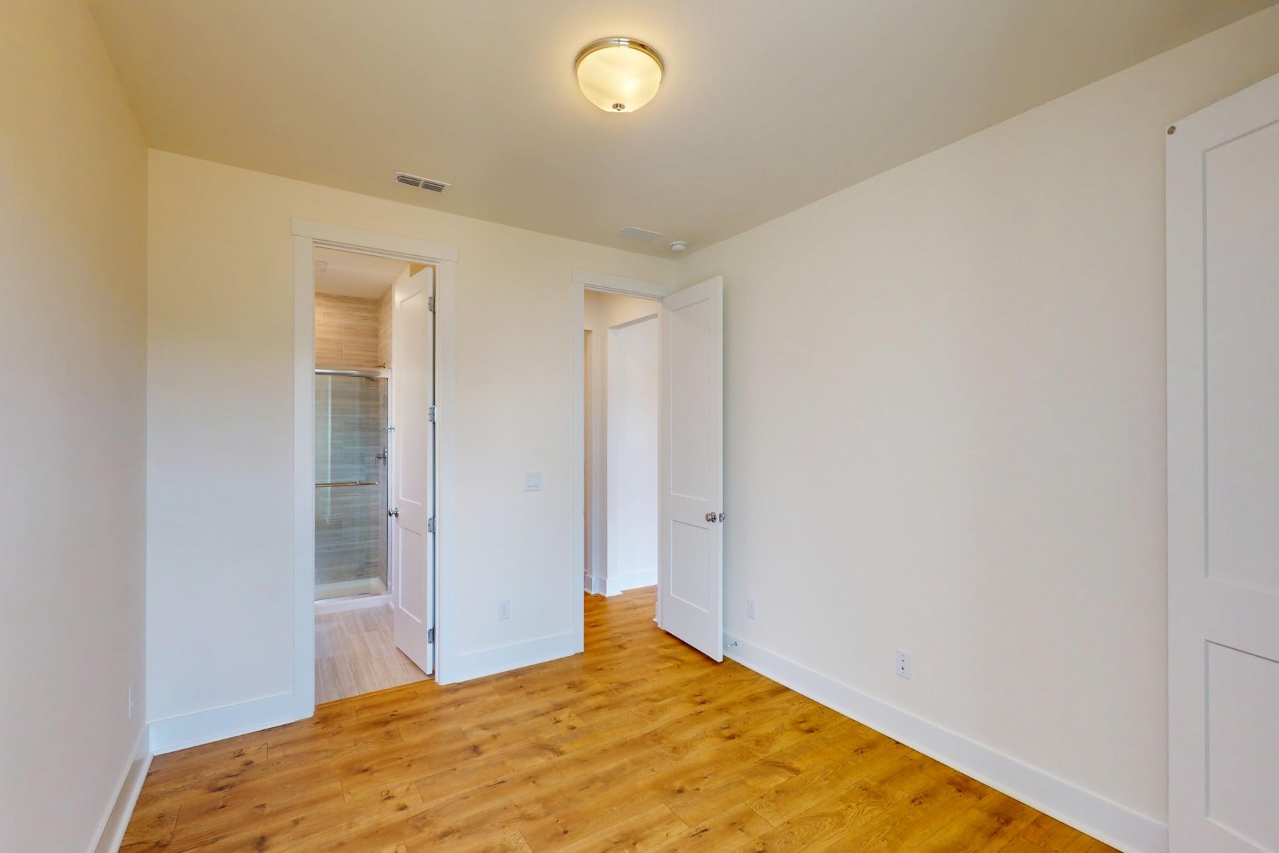 first floor bedroom with a full bathroom