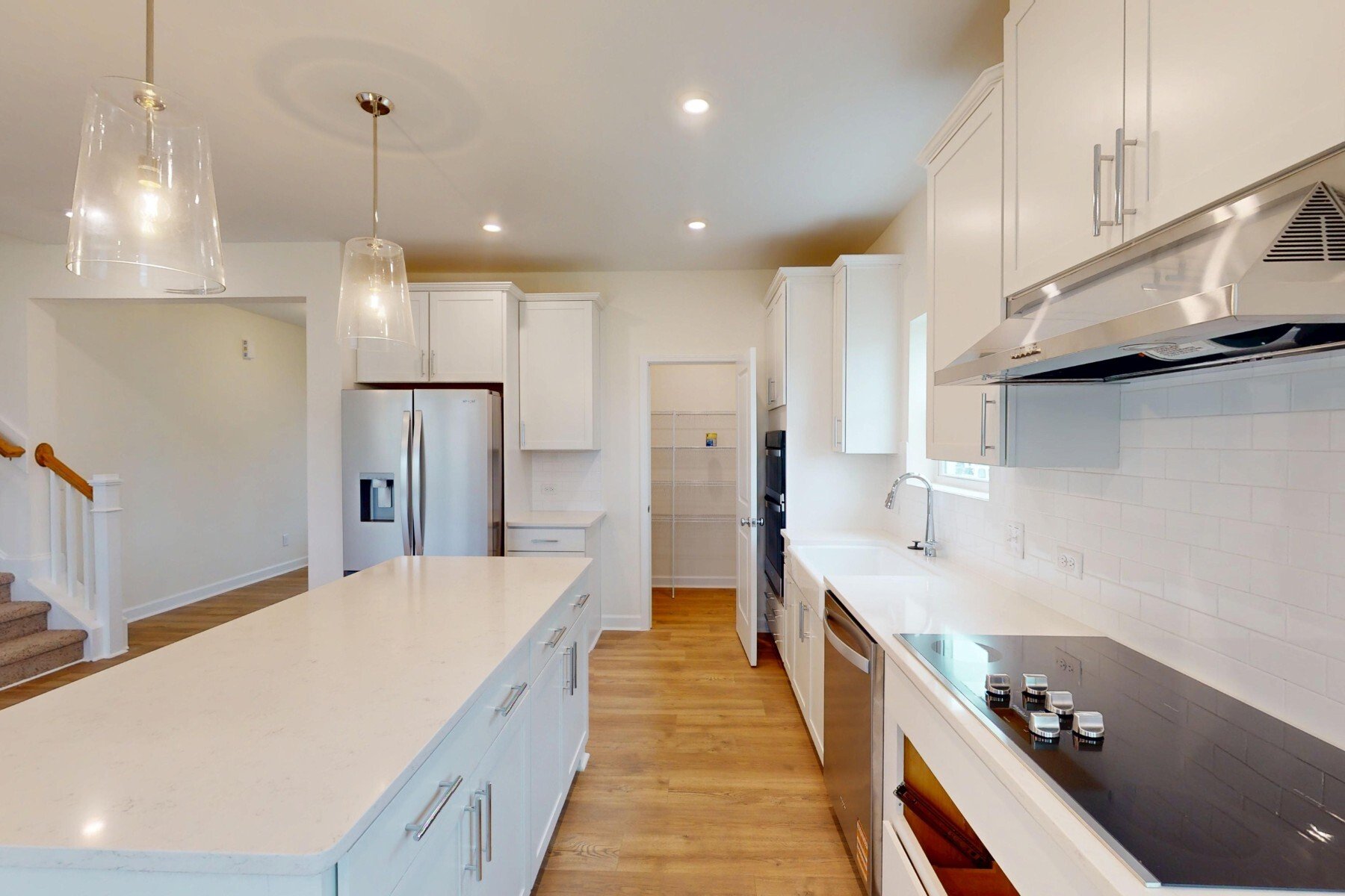 kitchen with white cabinets and countertops