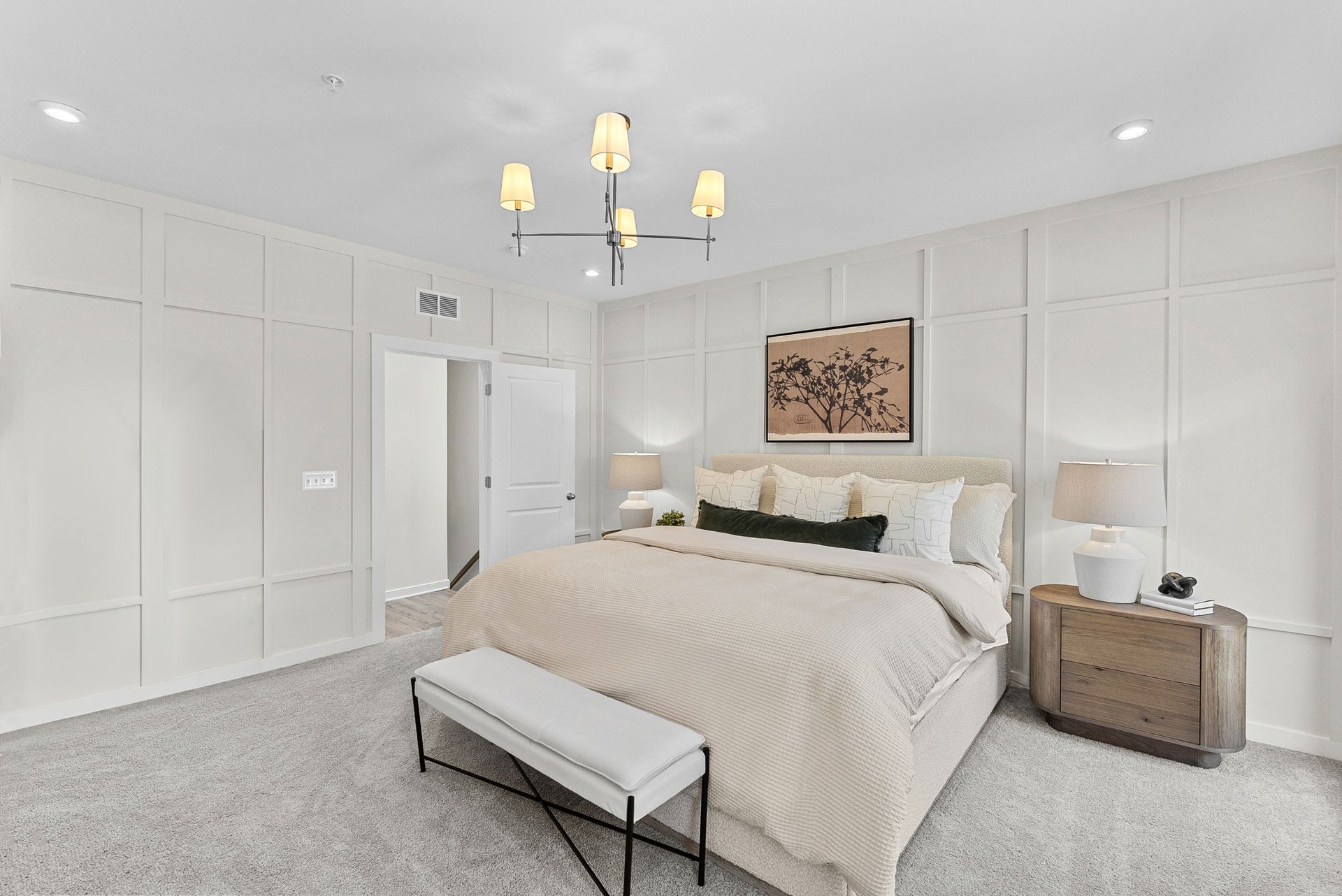 primary bedroom with carpet and a light fixture