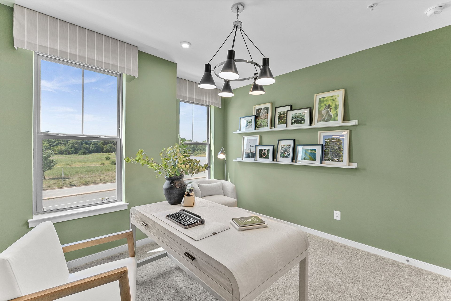secondary bedroom with two windows and a desk