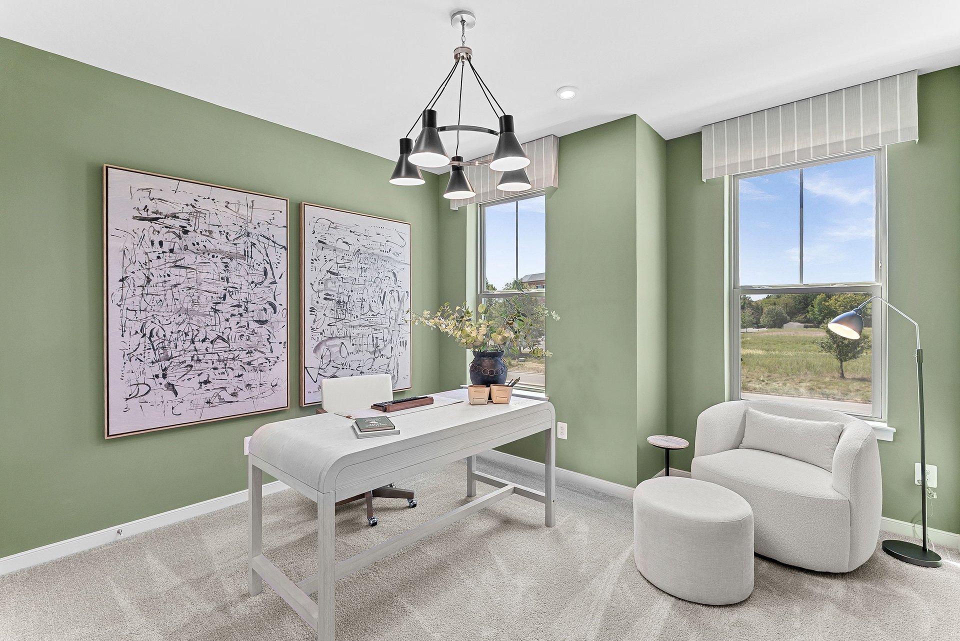 secondary bedroom with a seating area and two windows