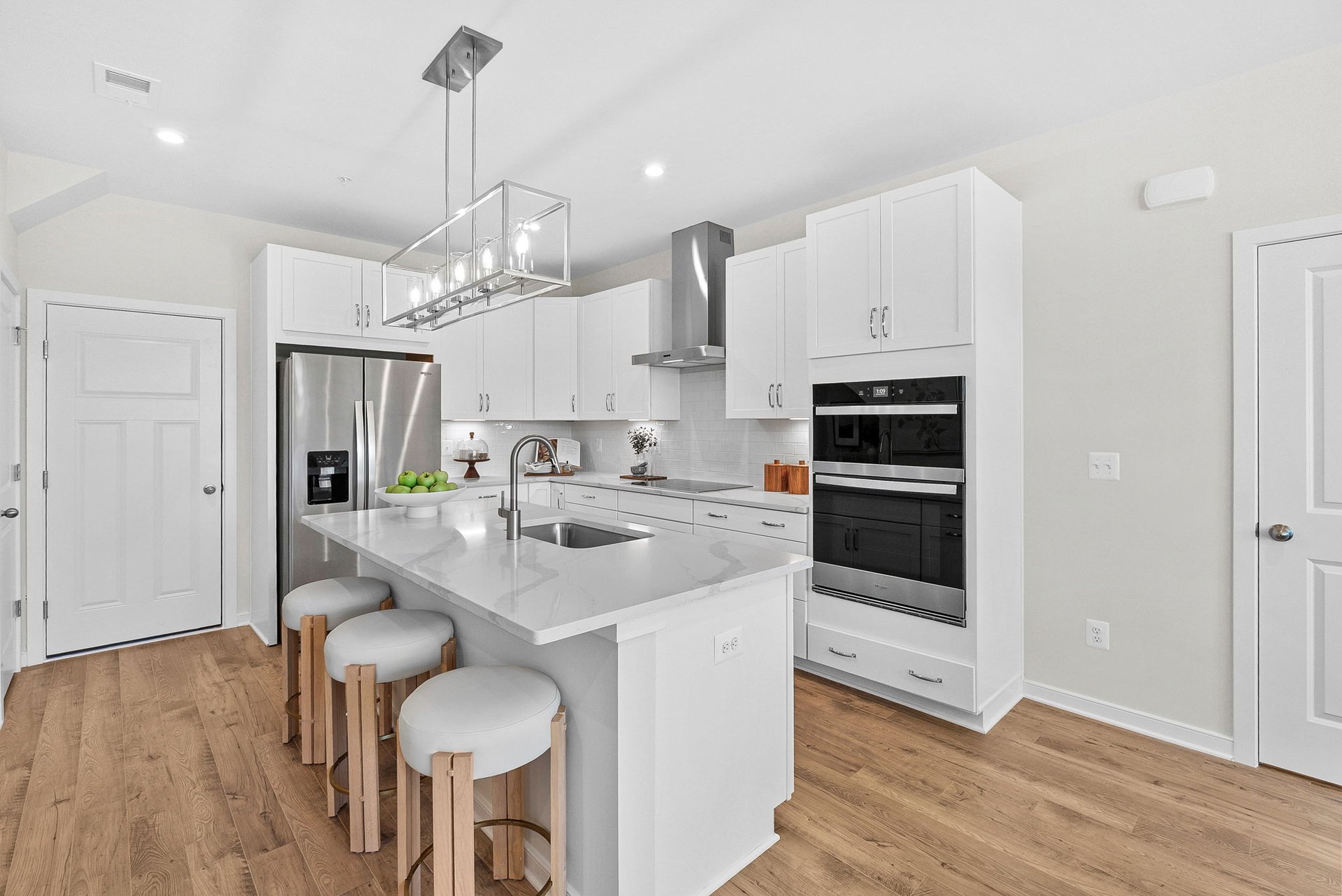 kitchen with an island with barstools 