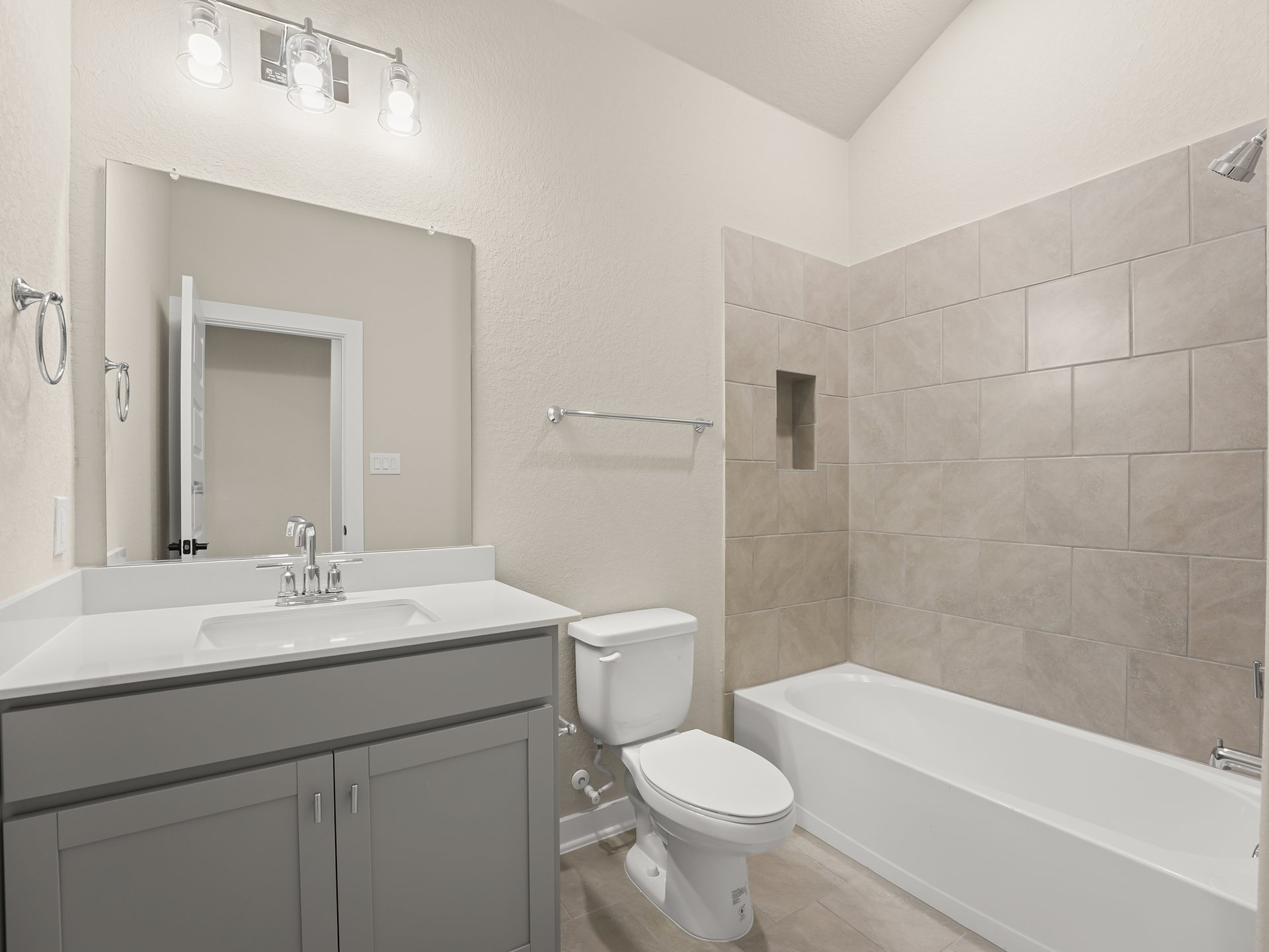 secondary bathroom with soaking tub and sink