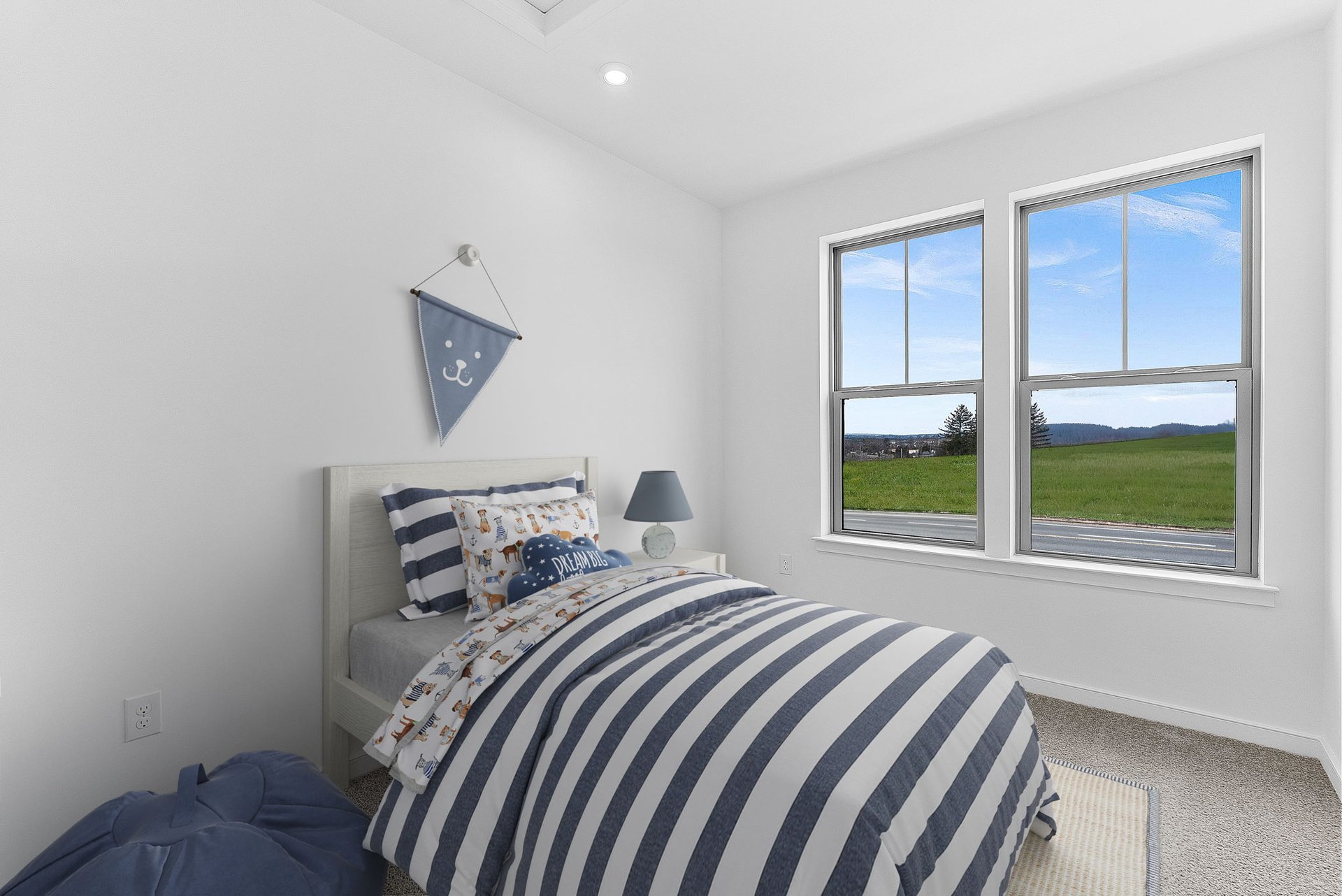 secondary bedroom with carpet and two windows