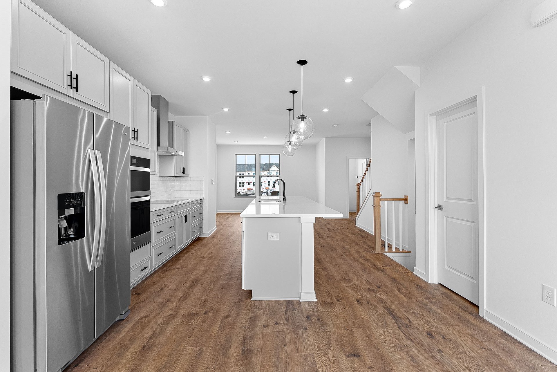kitchen with stainless steel appliances and view of the great room