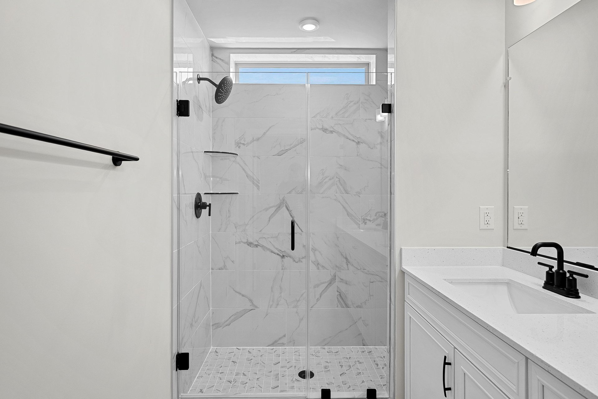 primary shower with a window