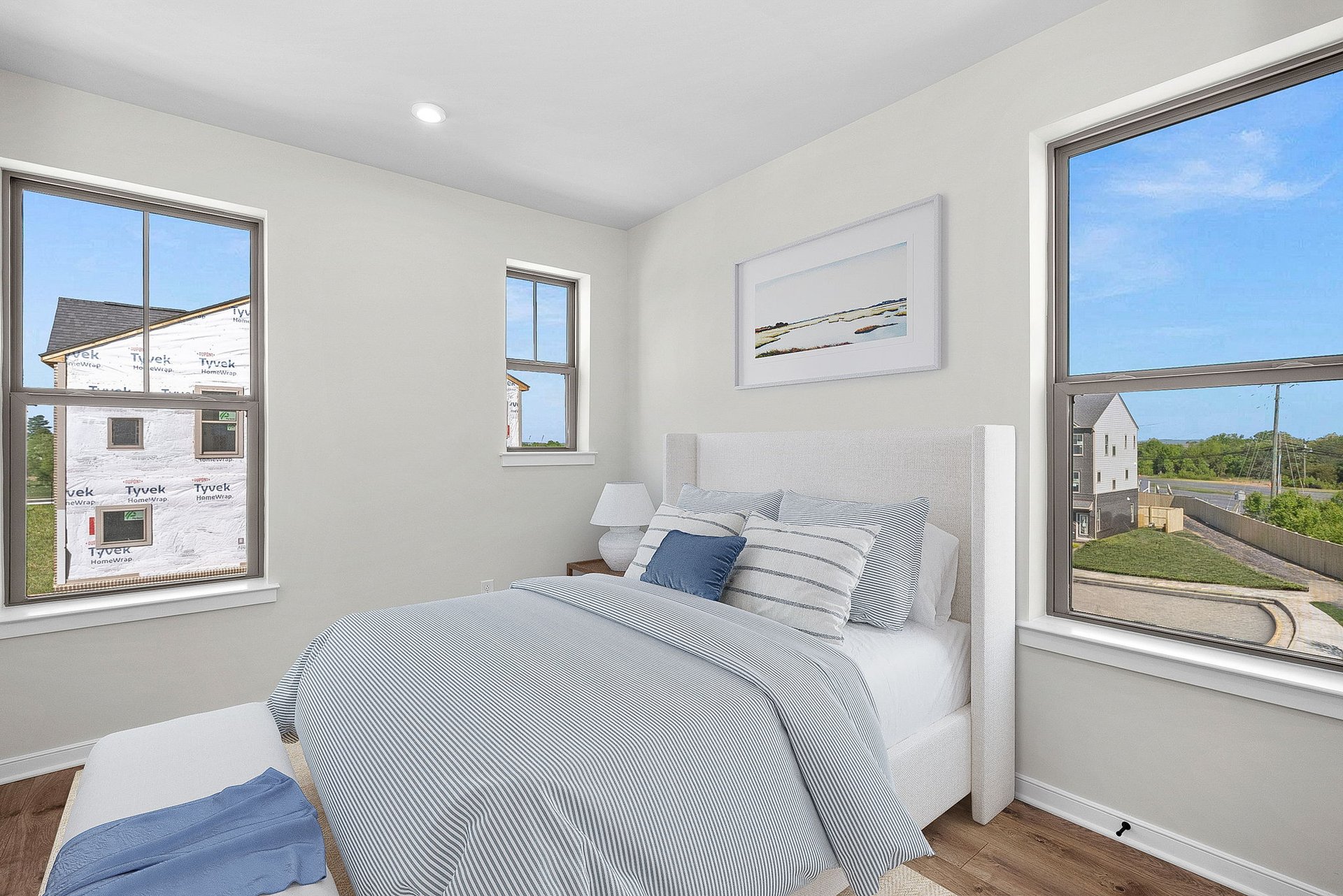 secondary bedroom with three windows