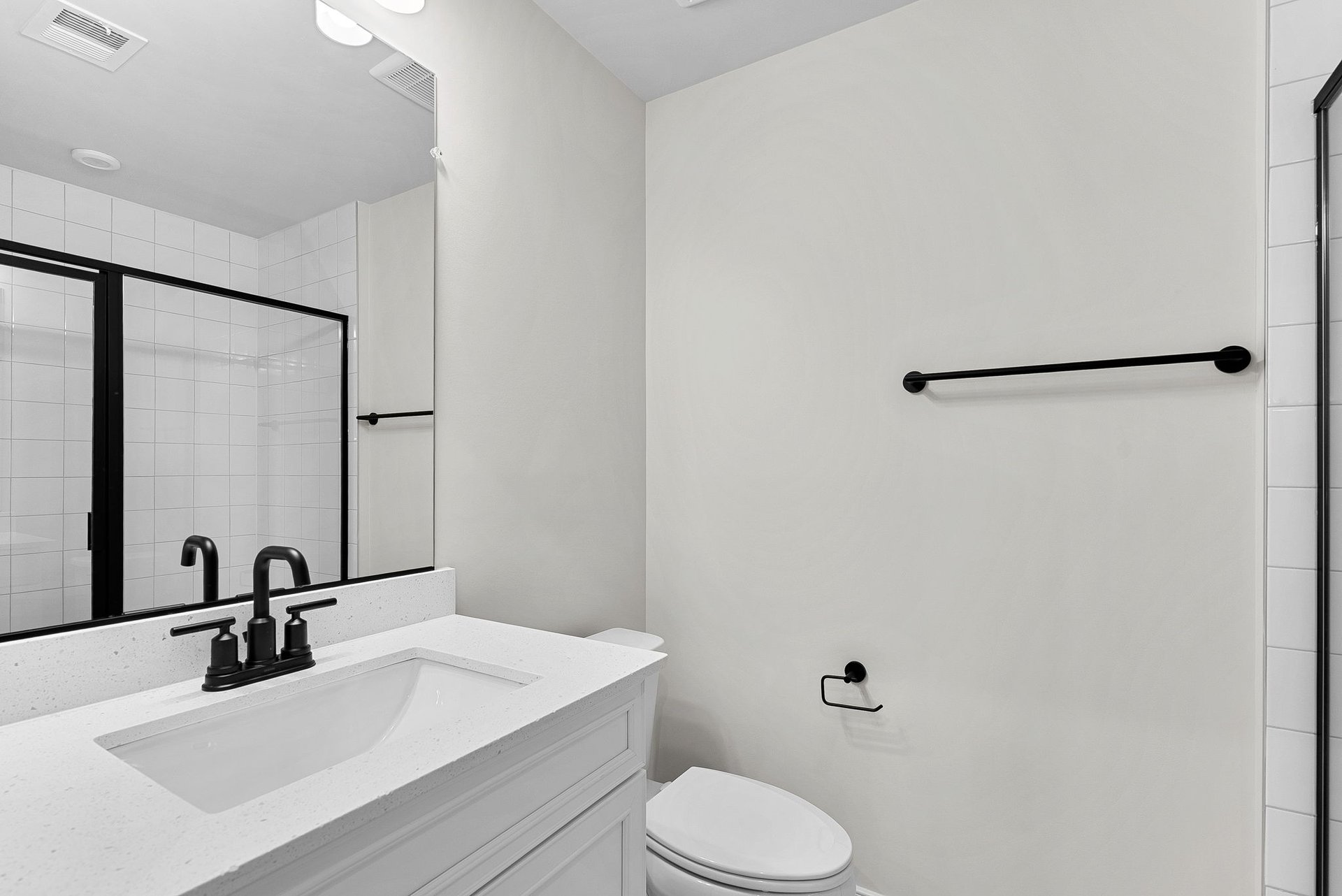lower-level secondary bathroom with an oversized shower