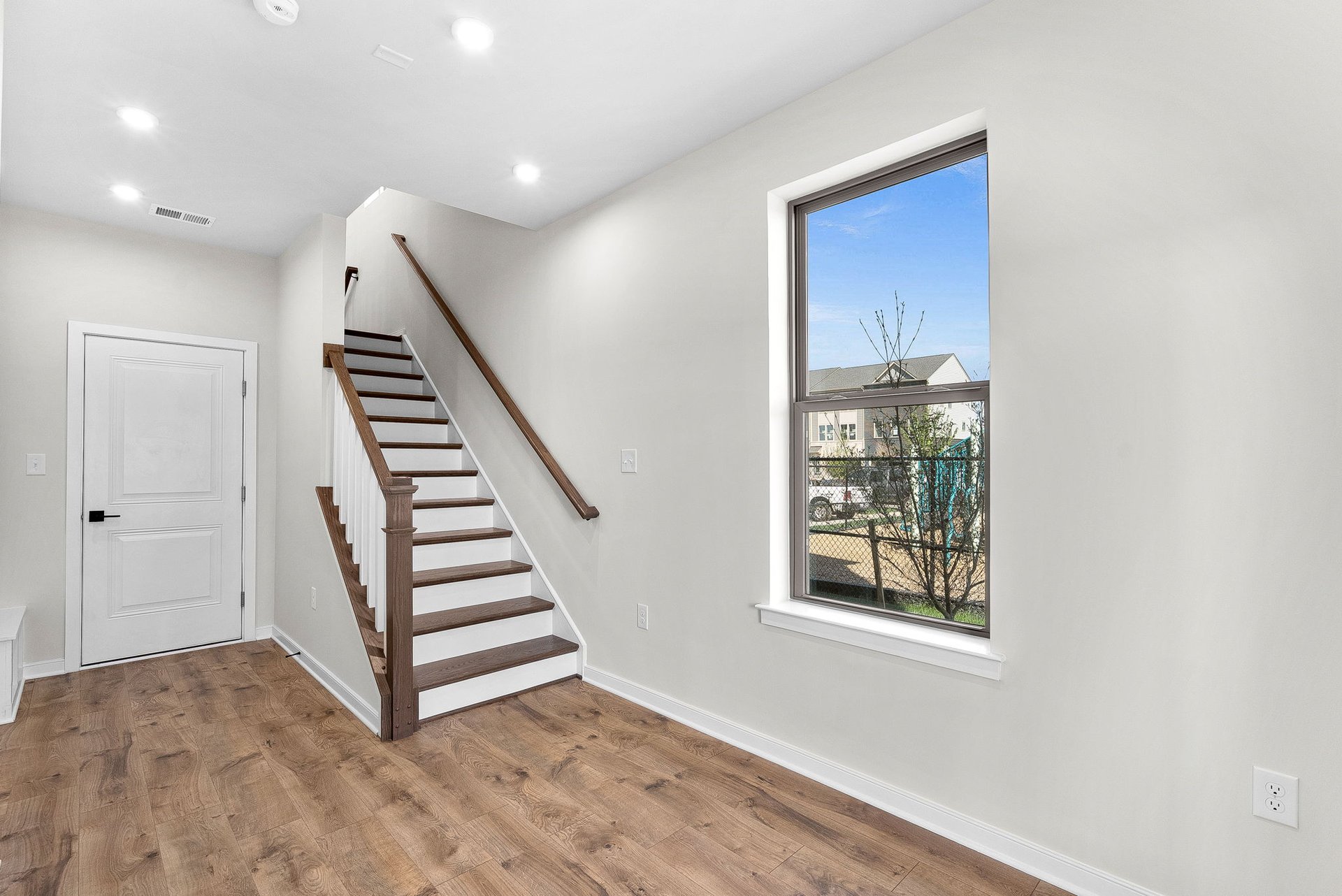 foyer with a bench and a window