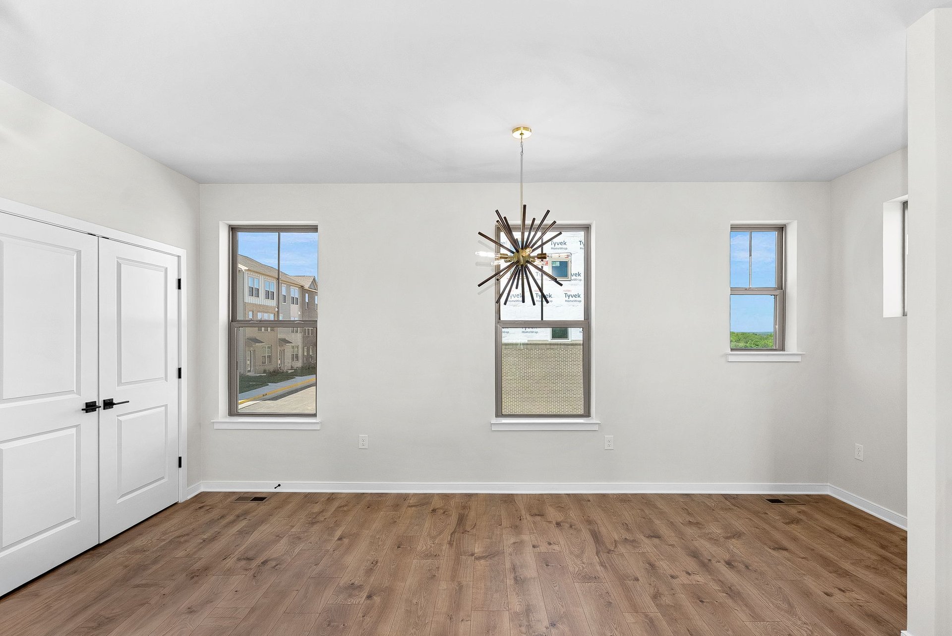 dining room with a pantry and several windows