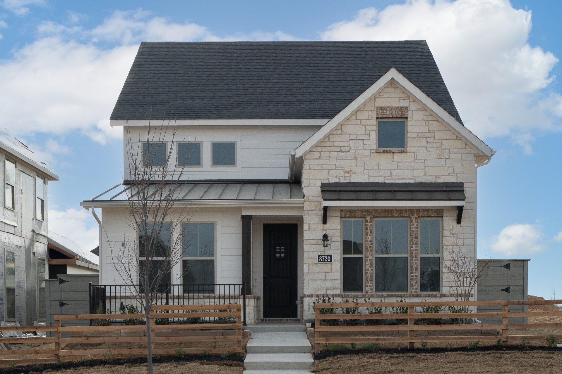 two-story home with brick and stone exterior