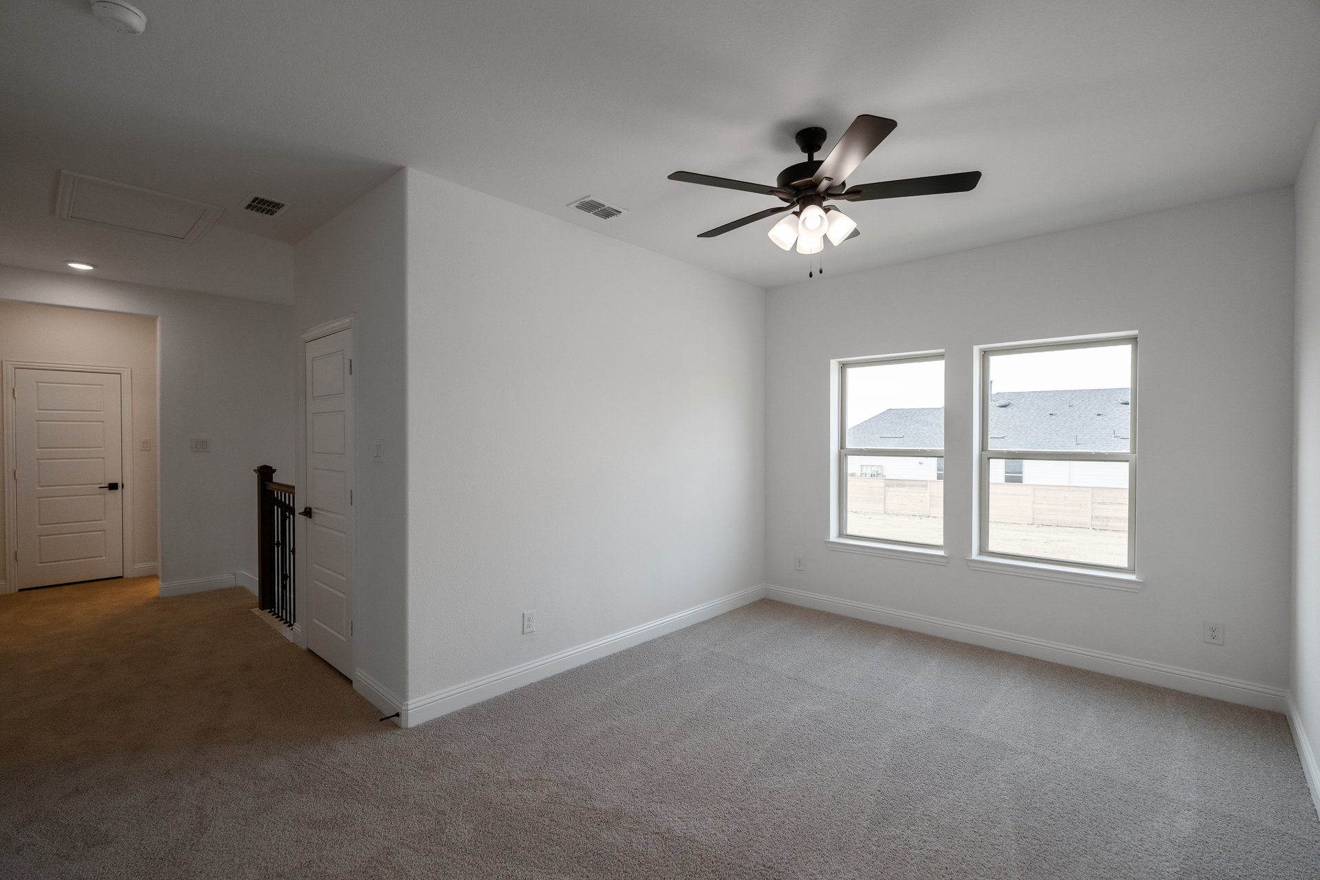 open gameroom with carpet and ceiling fan