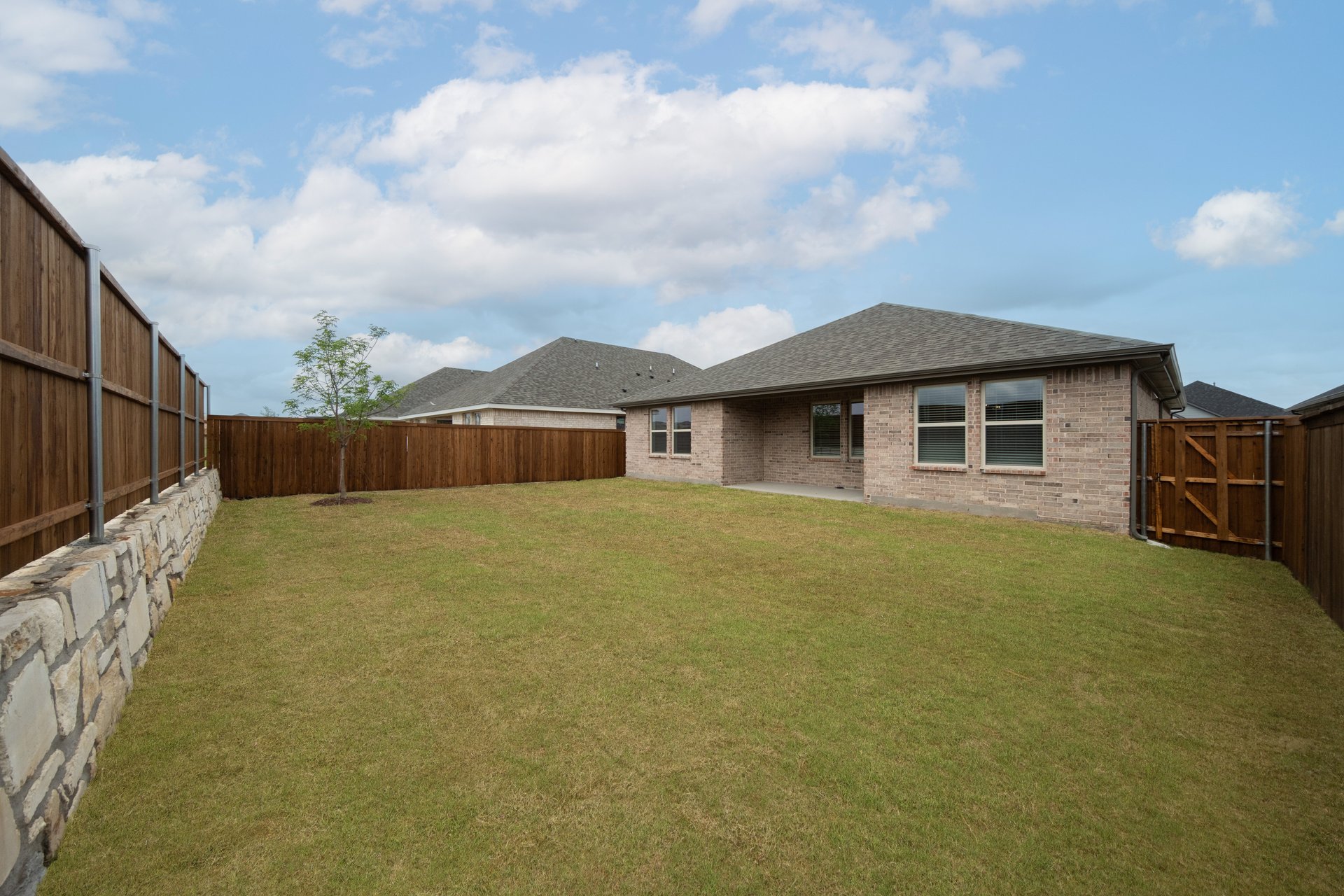 backyard with grass and covered patio