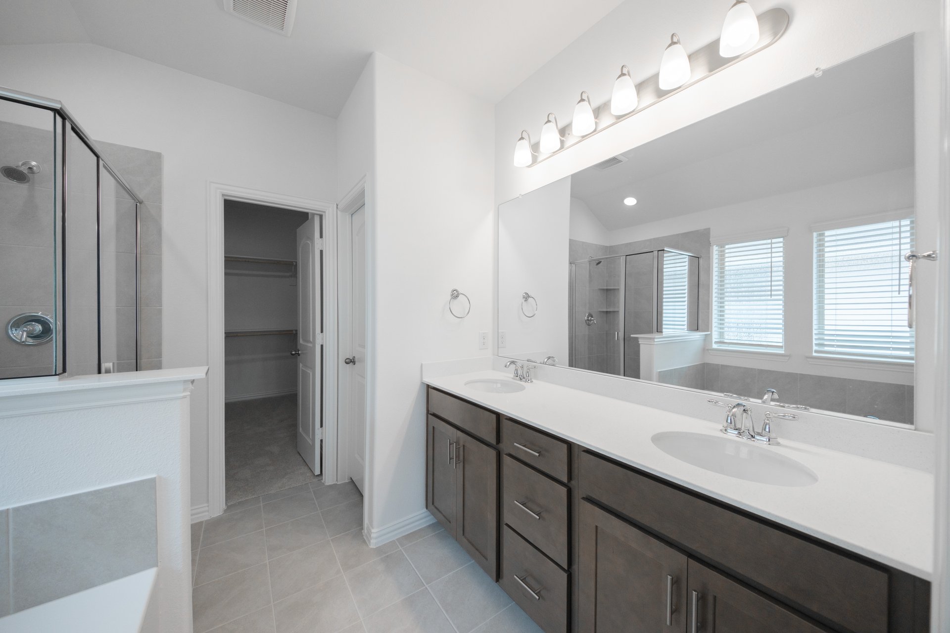 primary bathroom with soaking tub and walk-in shower