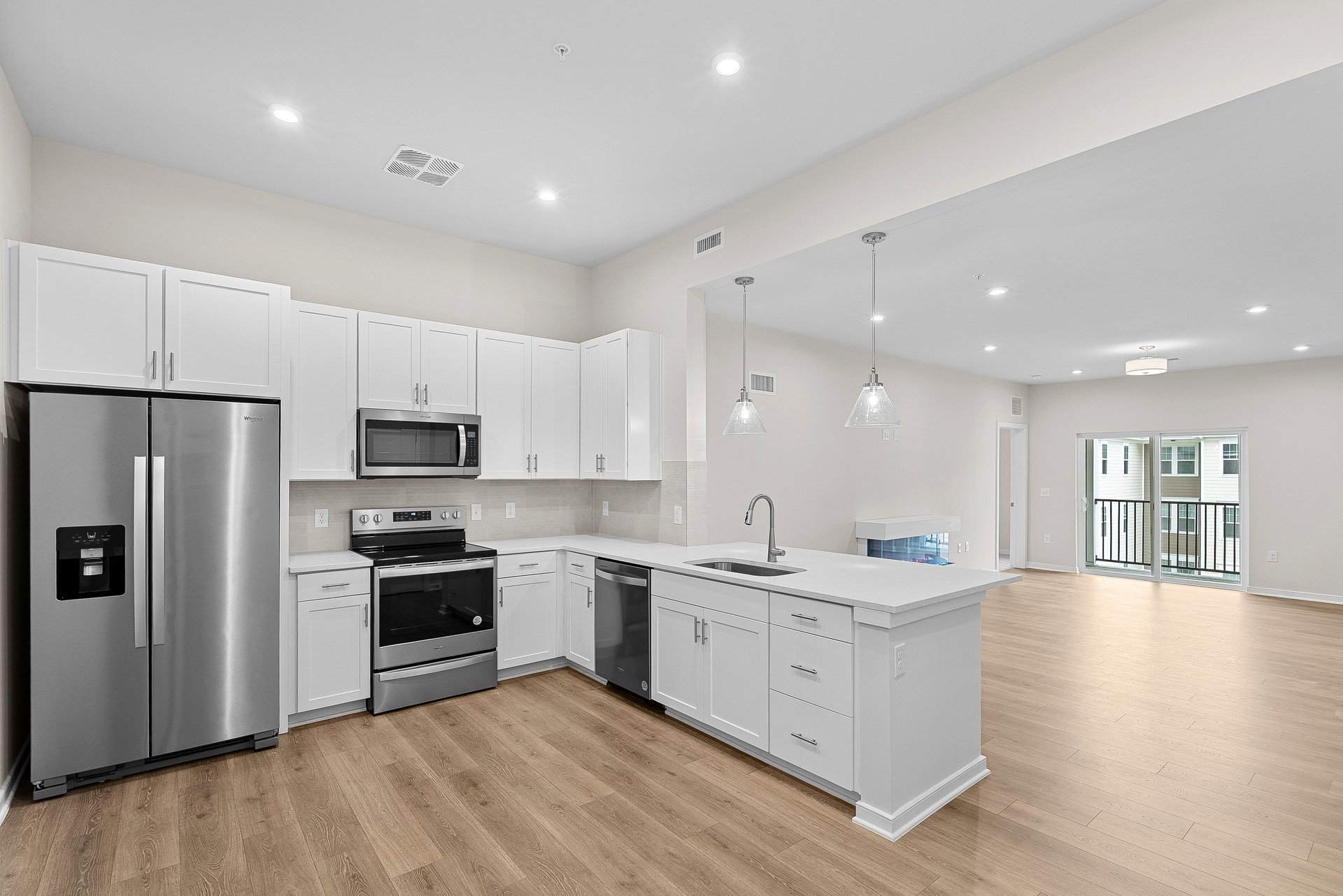 kitchen with quartz countertops and white cabinets