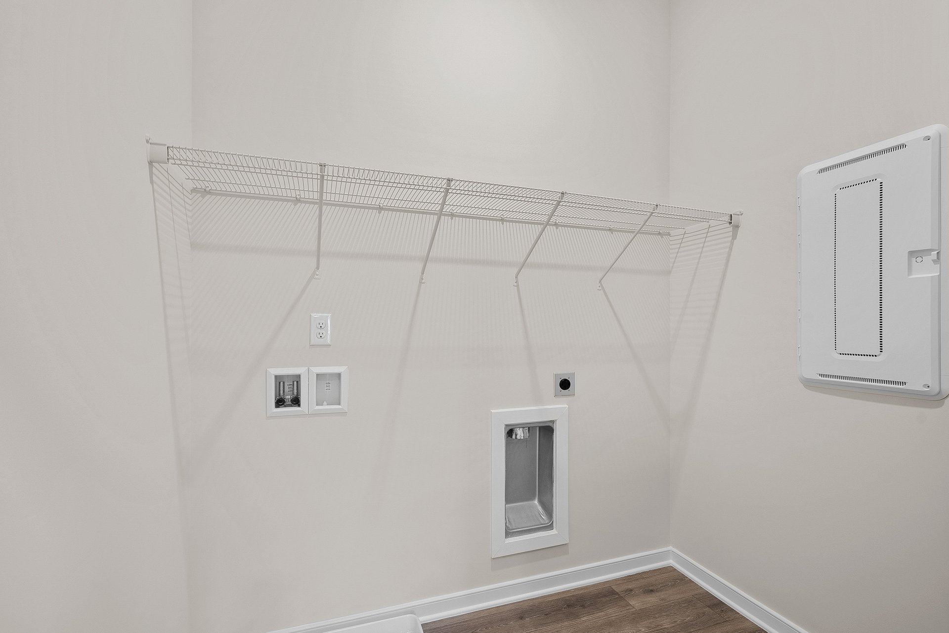 laundry room with voltage panel