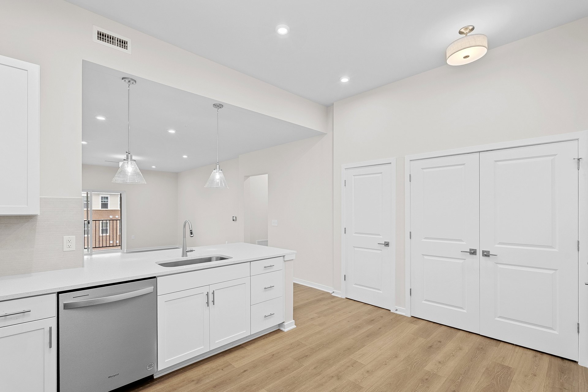 kitchen with quartz countertops and white cabinets