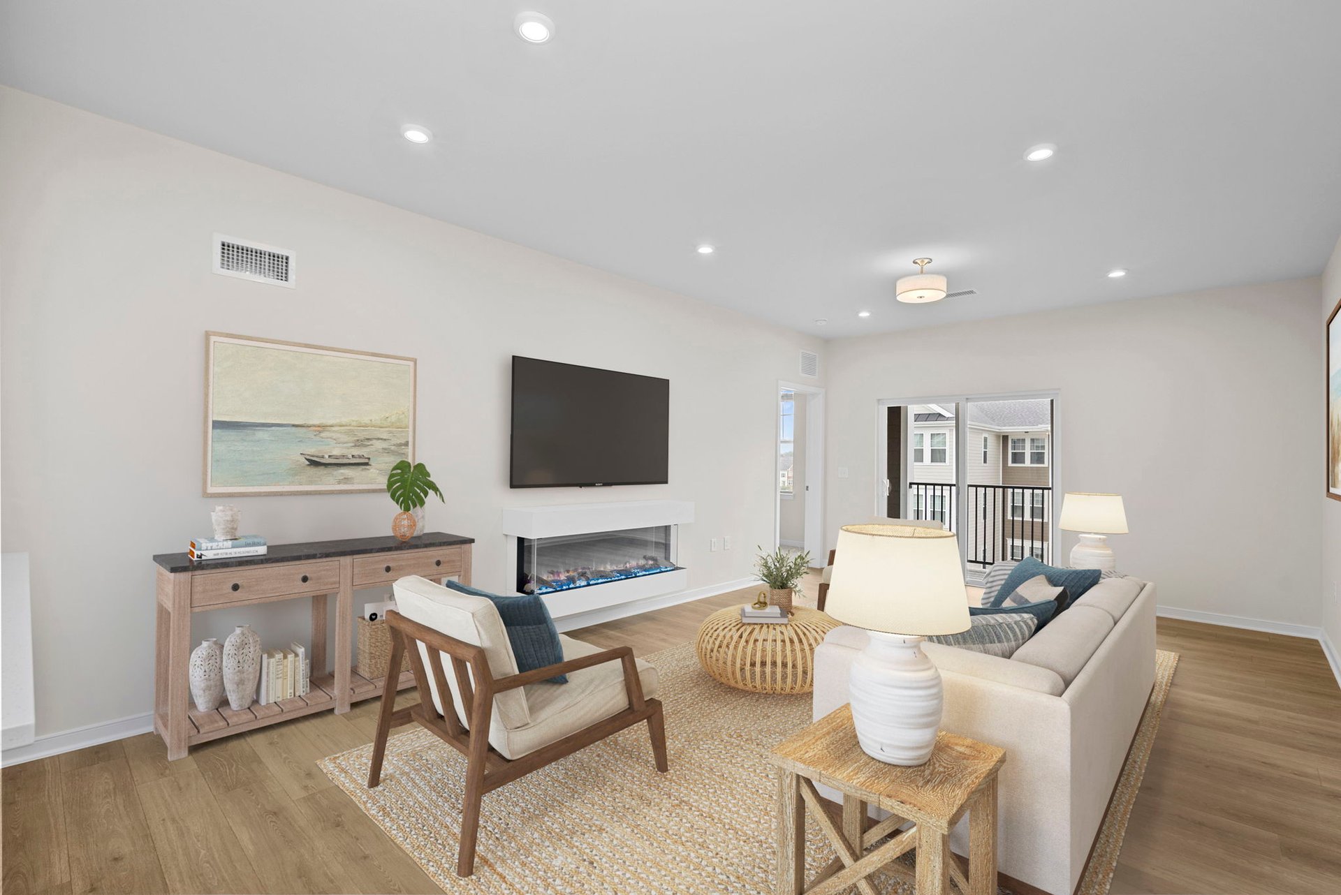 living room with tv, sofa, and chairs