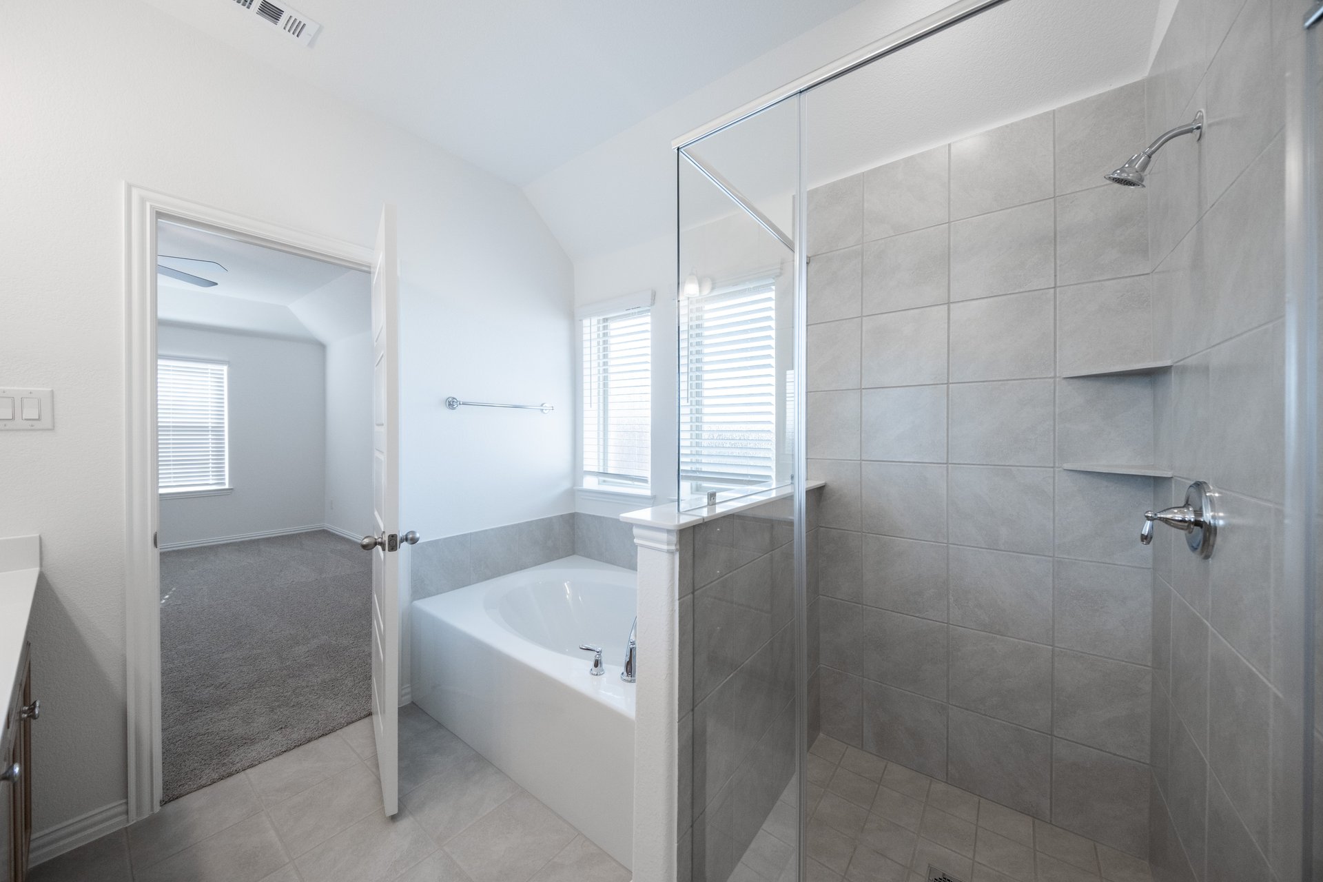 primary bathroom with soaking tub and walk-in shower