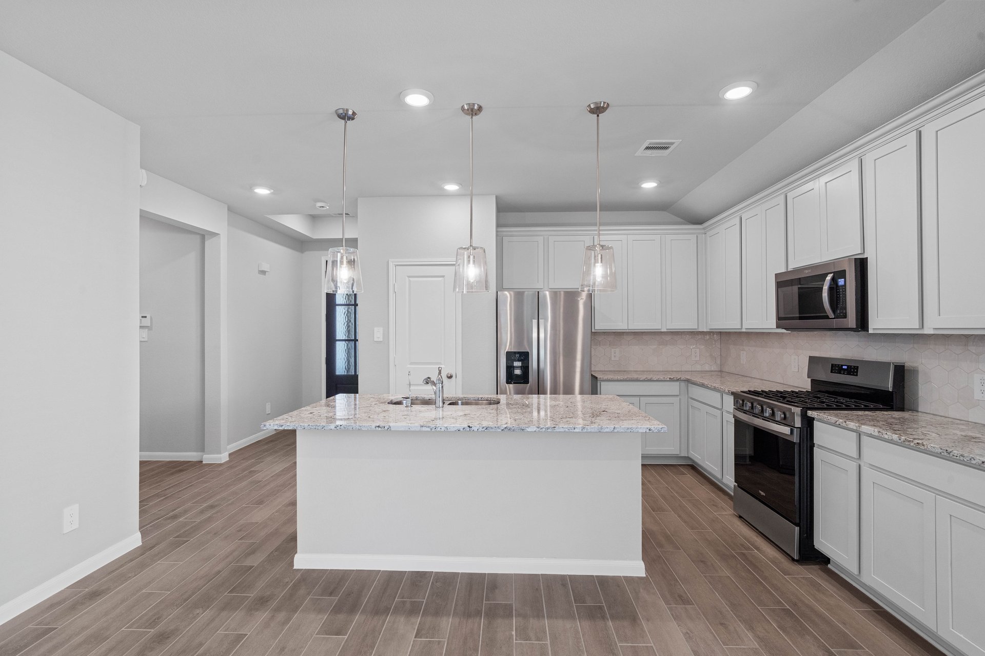 open kitchen with white cabinets