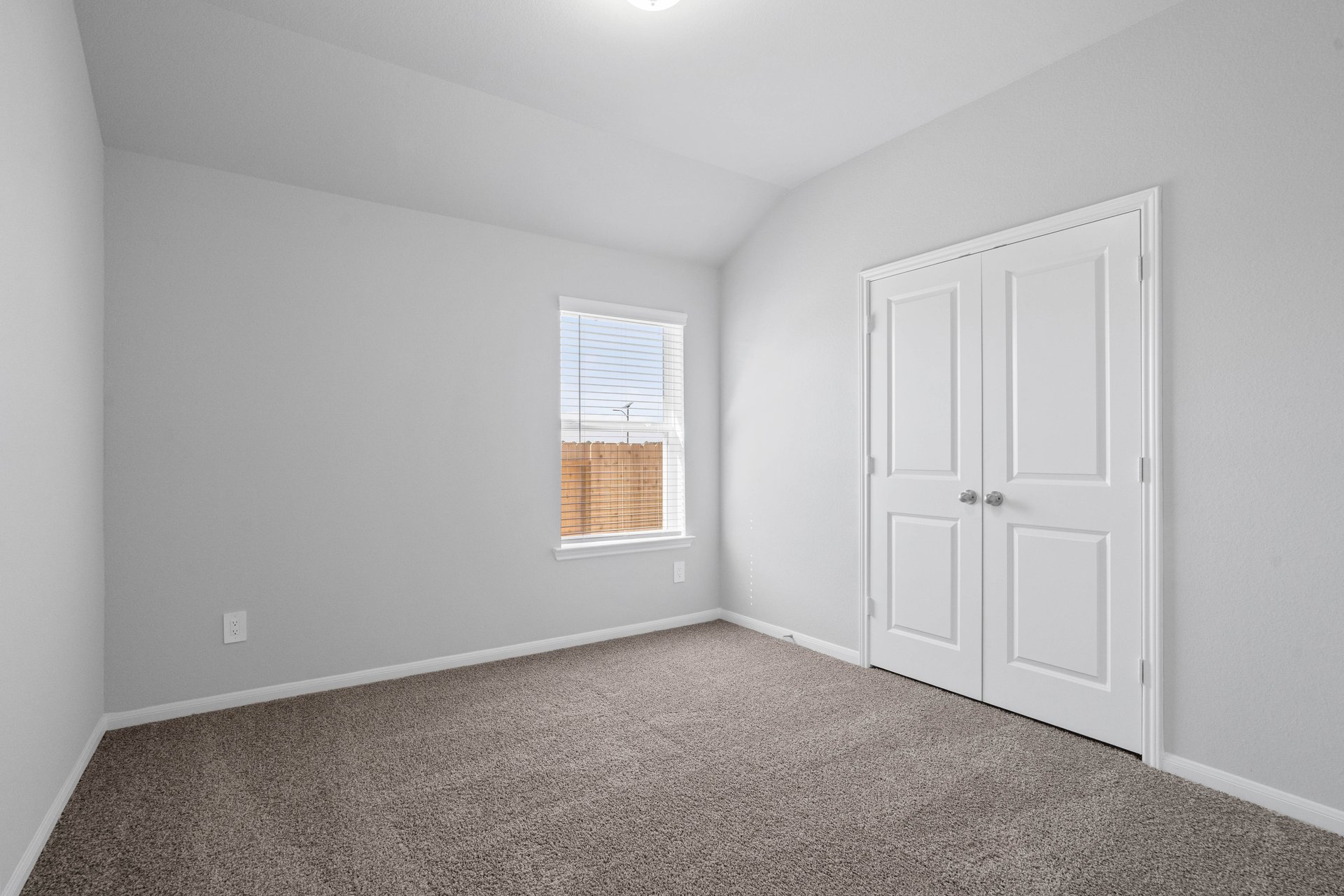 guest bedroom with carpet