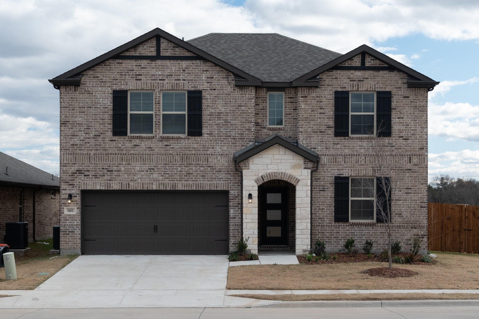 home exterior with brick and stone