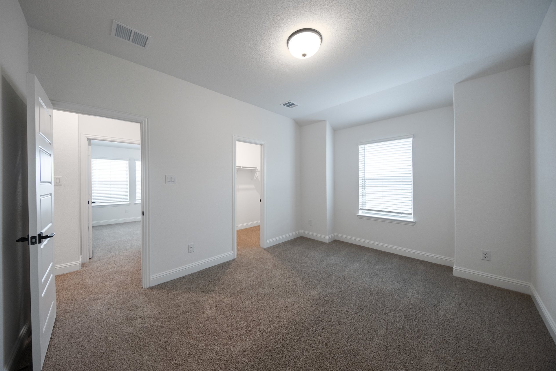 bedroom with carpet and window with blinds 