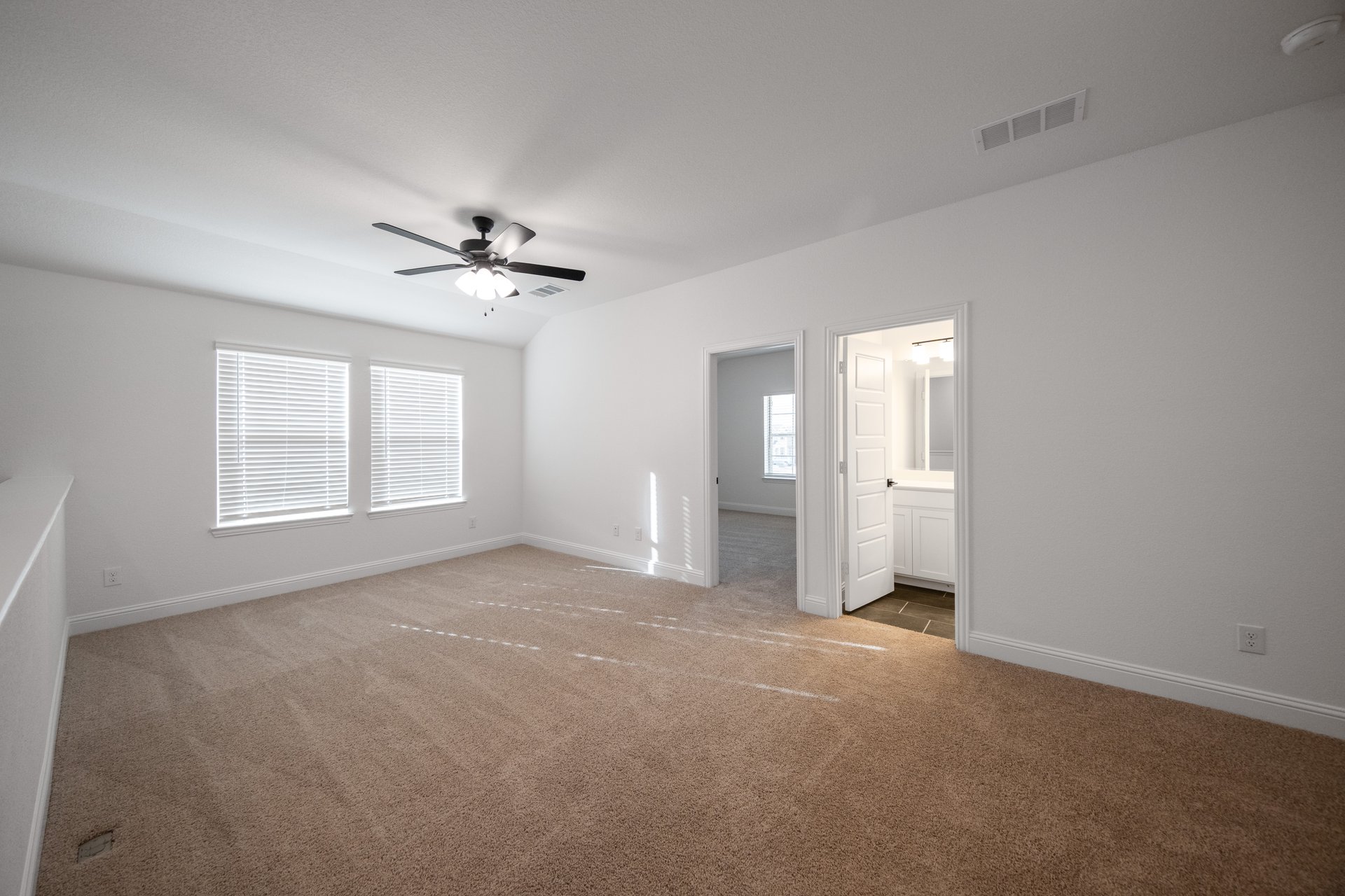 loft with carpet and ceiling fan 