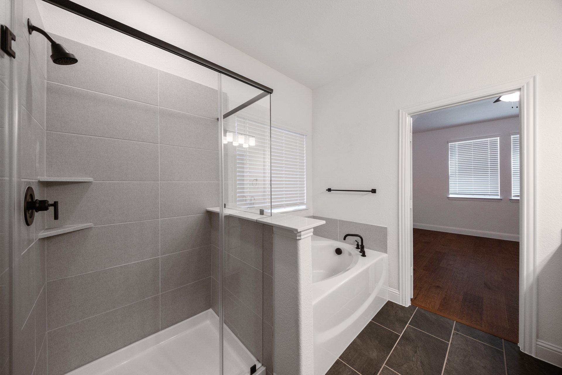 bathroom with walk-in shower and tub 