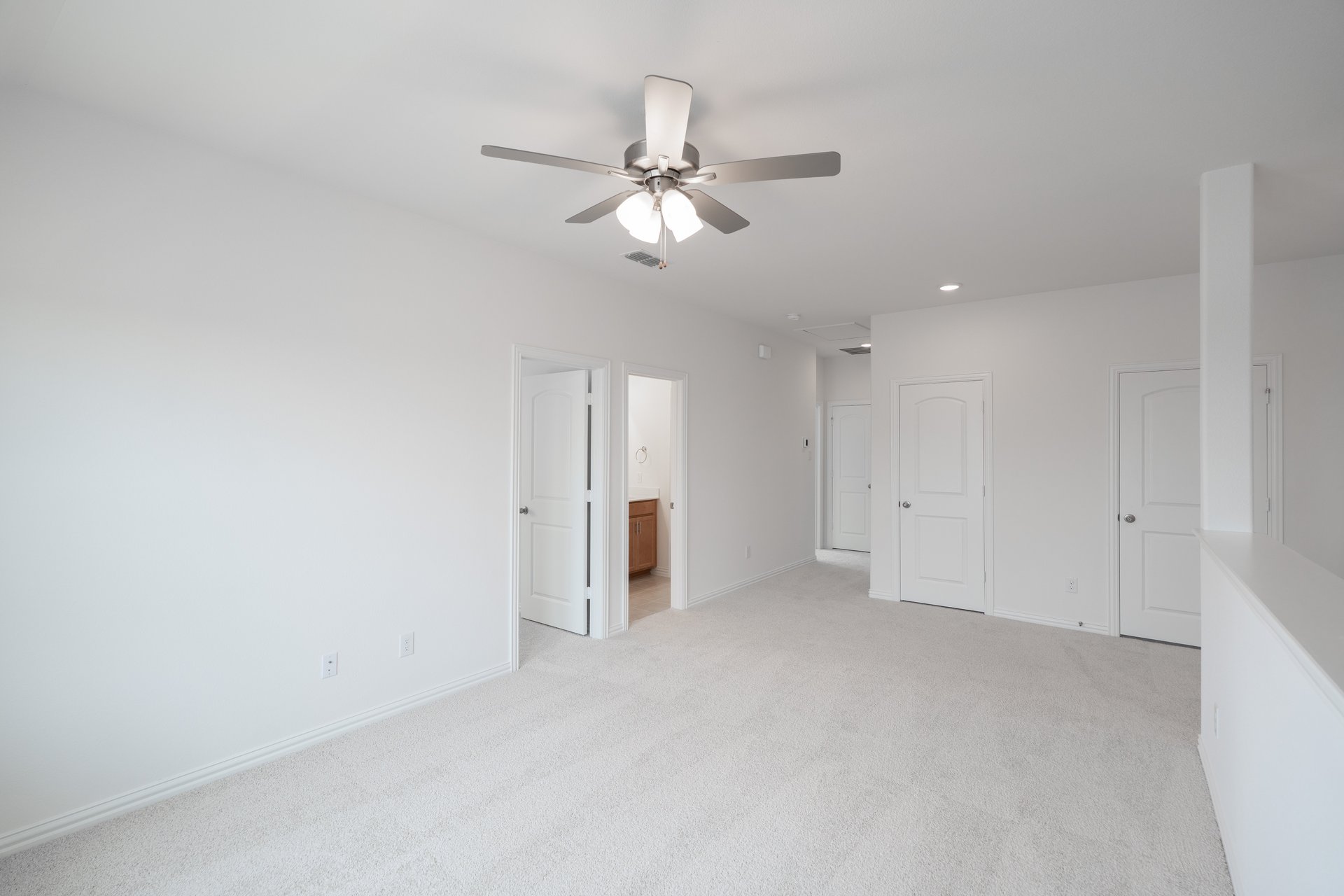 open gameroom with carpet and ceiling fan