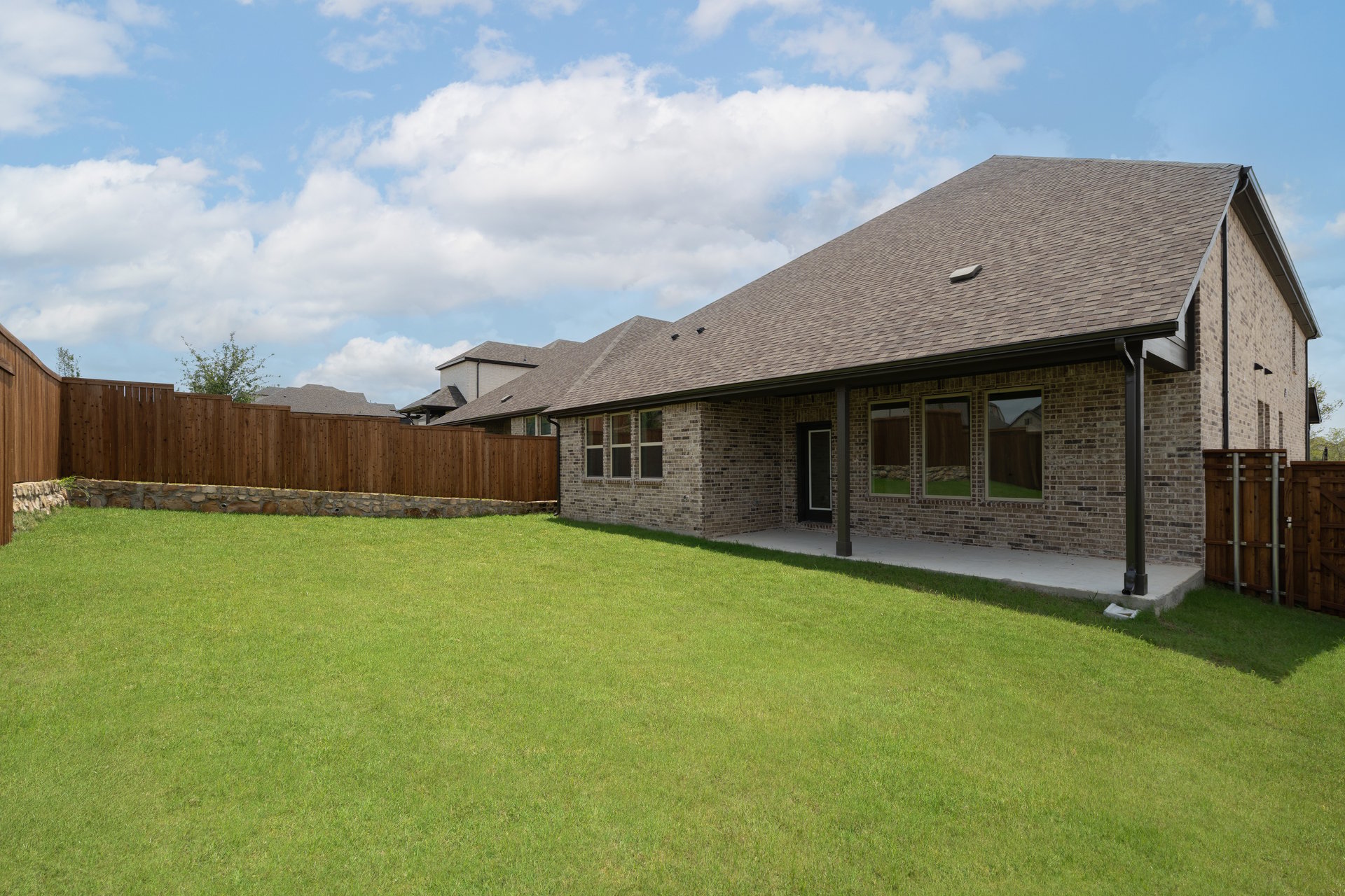 backyard with grass and covered patio